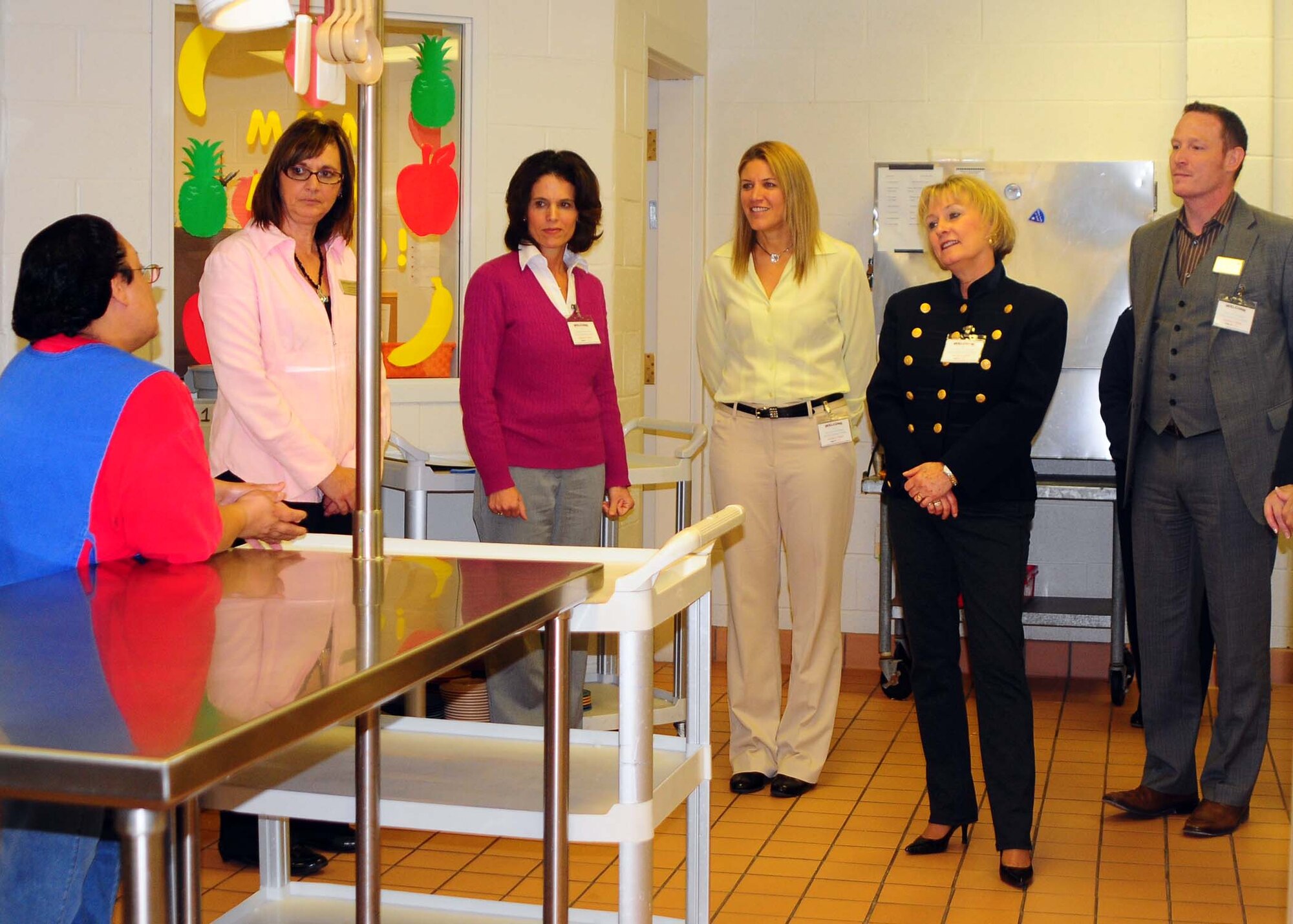 ALTUS AIR FORCE BASE, Okla.--Melissa Delgado, a member of the Altus Air Force Base Child Development Center staff, briefs Laurie Salafia, CDC Assistant Chief, Mrs. Leah Thomas, wife of 97th Air Mobility Wing commander, Mrs. Maggie Elder, wife of the 97th AMW vice commander, Mrs. Patty Solo, wife of 19th Air Force commander Major General Mark Solo, and Anthony Raas, 97th Force Support Squadron, about how they prepare children?s food at the CDC. During the tour, Mrs. Solo was updated on the changes the CDC has undergone as well as the facility's accomplishments. (U.S. Air Force photo/Senior Airman Leandra D. Stepp/Released 97th Air Mobility Wing Public Affairs)