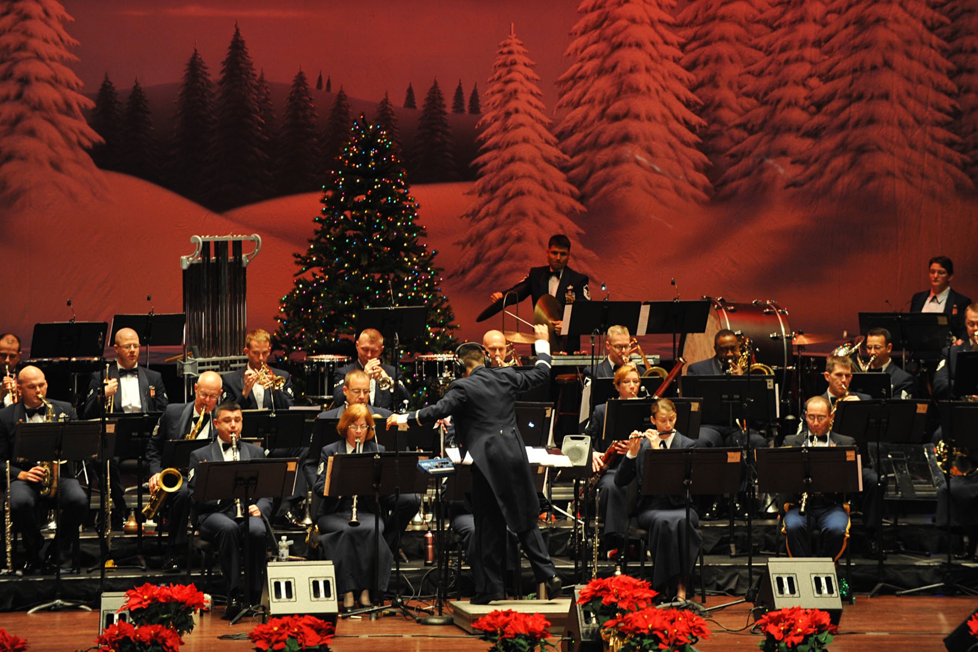 NEWPORT NEWS, Va. -- 2nd Lt. Rafael F. Toro-Quinones, commander of the Heritage of America Band, Air Combat Command, conducts the musical session during the holiday concert at the Christopher Newport University's Ferguson Center for the Arts, Dec. 2. The annual event is a series of concerts held by the band as a means to say thank you to the local community for their support for military personnel. (U.S. Air Force photo/Staff Sgt. Ashley Hawkins)(RELEASED)