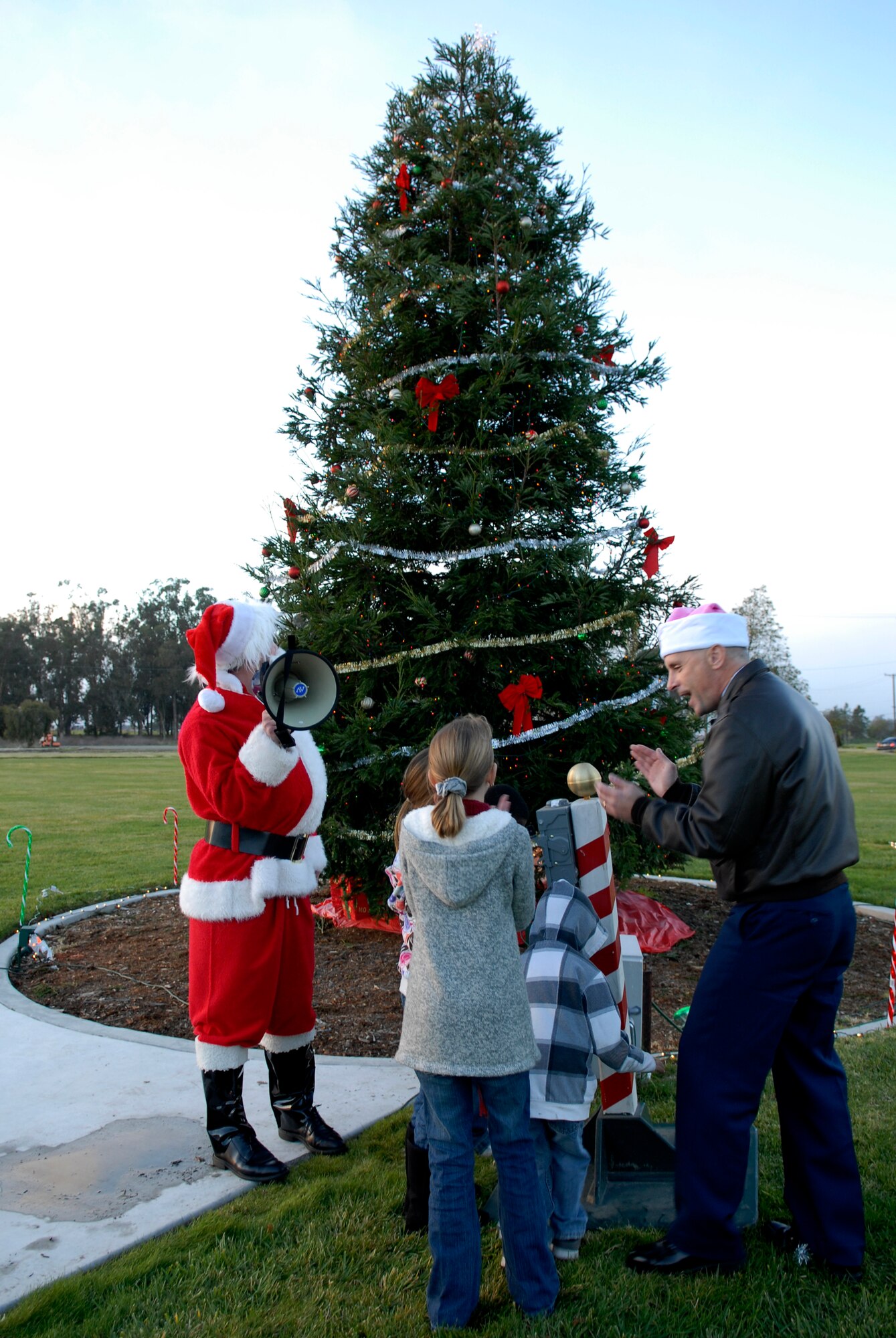 VANDENBERG AIR FORCE BASE, Calif. – Families, children and wing leadership here cheered at the annual holiday tree lighting ceremony here Monday, Dec. 6, 2010.  Col. Richard Boltz, 30th Space Wing commander, spoke to the families in the audience about the importance of the holiday season.  (U.S. Air Force photo/Senior Airman Andrew Satran)
     