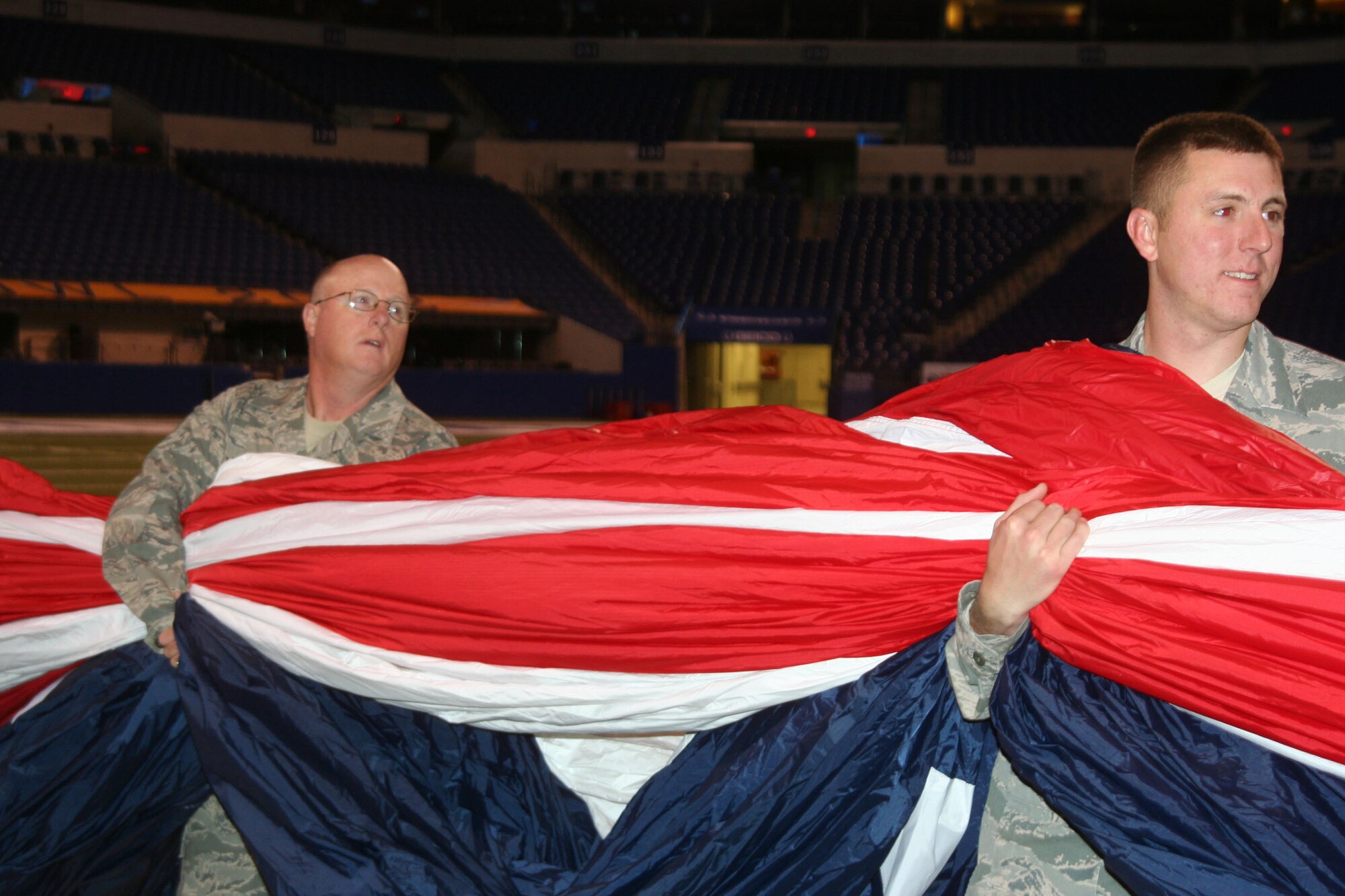 WRIGHT-PATTERSON AIR FORCE BASE, Ohio –Chief Master Sgt. Bill Millar, 445th Aerospace Medicine Squadron, practices holding the large flag with other military men and women from various units, including the 445th Airlift Wing, that will be used during the pre-game activities for the Cincinnati Bengals vs Indianapolis Colts football game Nov. 14. The Wright-Patterson Air Force Base Honor Guard also performed during the pre-game activities (U.S. Air Force photo/Capt. Rod McNany)