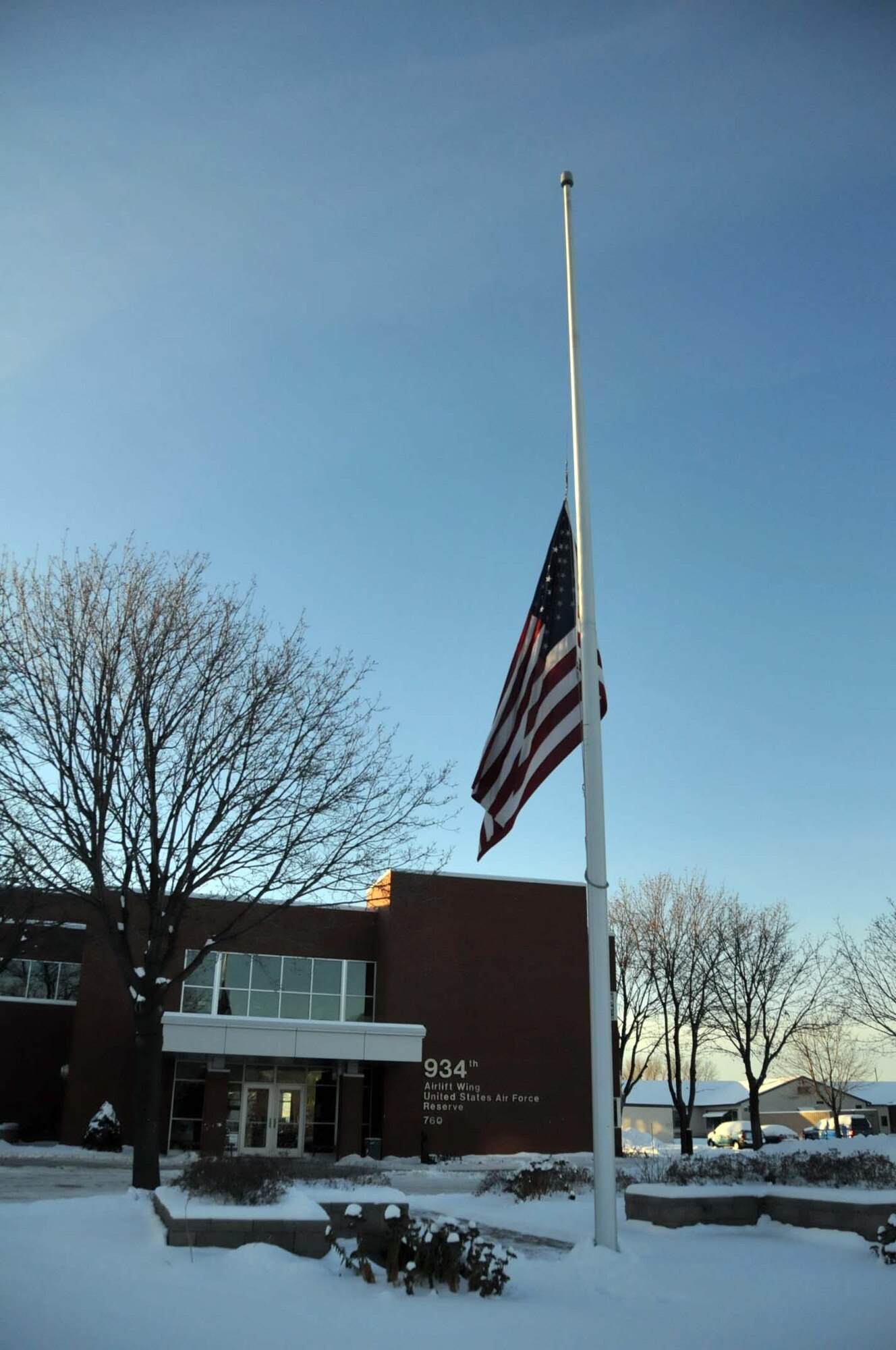 The flag flies at have mast in front of 934th Airlift Wing headquarters in honor of those who died at Pearl Harbor. (Photo by Paul Zadach)
