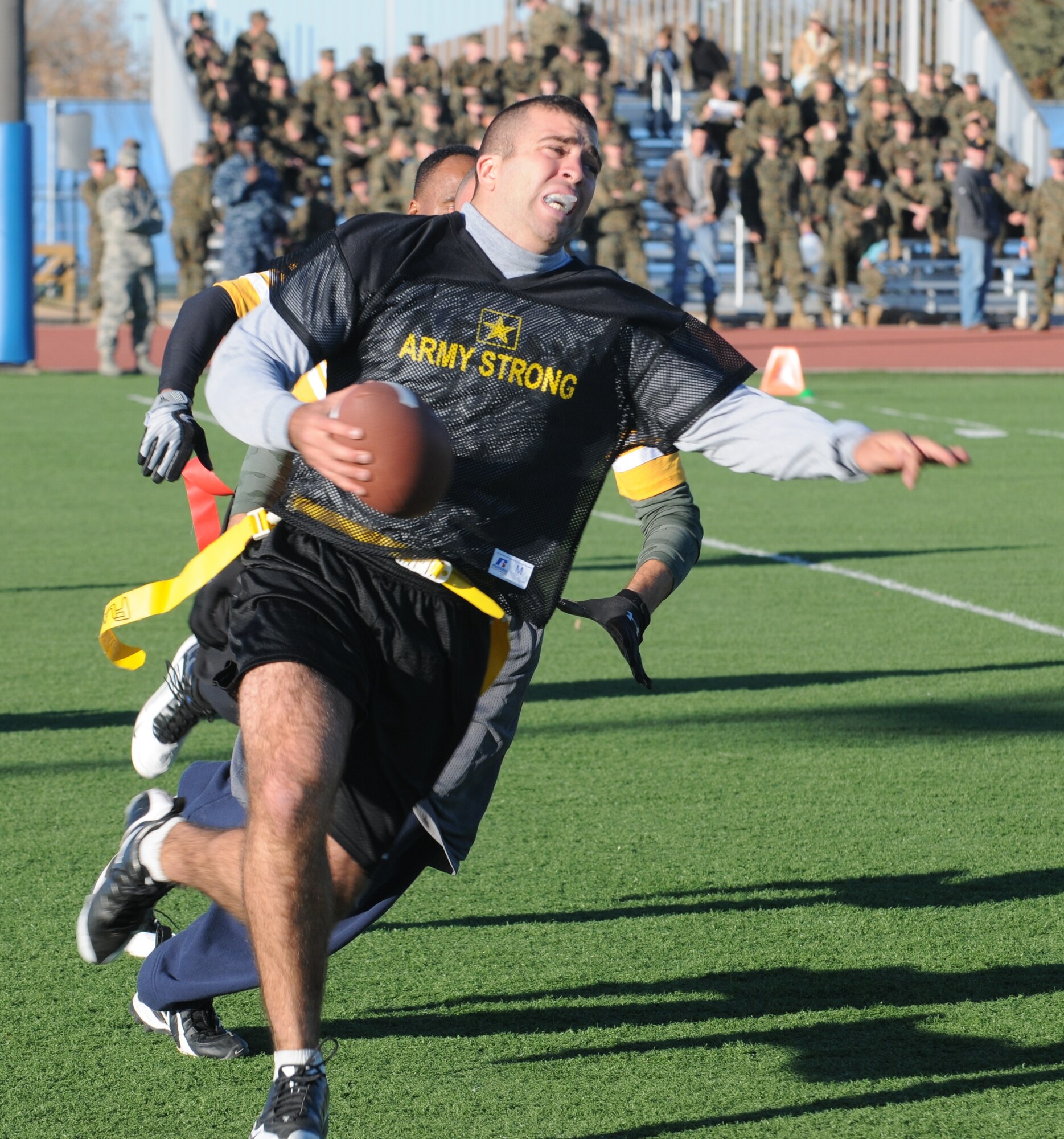 GOODFELLOW AIR FORCE BASE -- Army player Anthony Marolo runs the ball during the the Army/Navy Flag Football Game Dec. 1.  The Army defeated the Navy during the annual challenge: 28-12.  (U.S. Air Force Photo/Airman 1st Class Clayton Lenhardt)