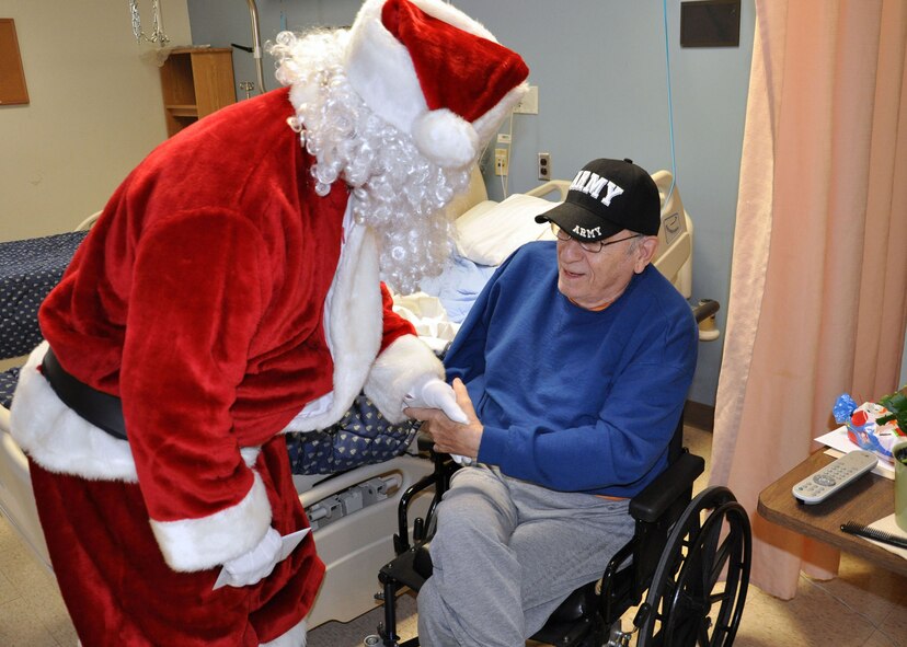 WRIGHT-PATTERSON AIR FORCE BASE, Ohio –Santa Clause and Airmen of 445th Airlift Wing attended the annual Christmas party at the Dayton VA Medical Center Dec. 4, providing gifts and companionship to the local VA residents. (U.S. Air Force photo/Senior Airman Matthew Cook)