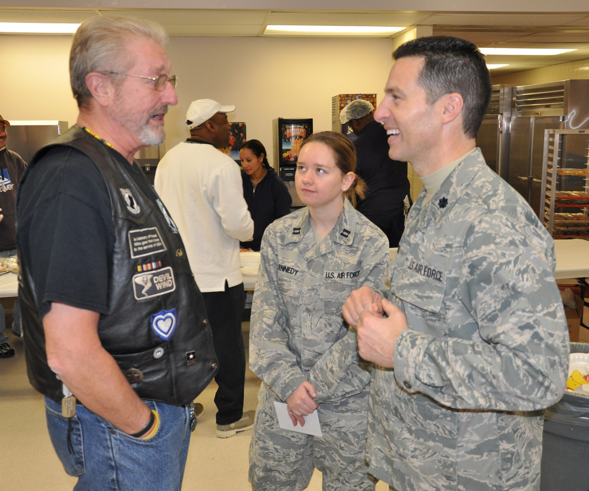 WRIGHT-PATTERSON AIR FORCE BASE, Ohio – Lt. Col. Michael Brandenburg, 445th Communications Flight, and Capt. Stephanie Kennedy, 445th Force Support Squadron, spent the morning spreading holiday cheer for the residents at the Dayton VA Medical Center Dec. 4. Airmen of 445th Airlift Wing attend the annual Christmas party and provide gifts and companionship to local VA residents. (U.S. Air Force photo/Senior Airman Mikhail Berlin)
