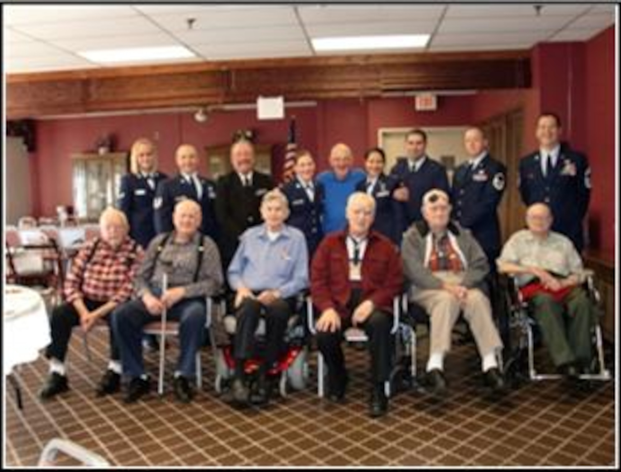 A group of veterans poses for a group photo op with 103rd Airlift Wing members. The event was the brain child of Kathi Carney, Director of Activities for the home. She reached out through a mutual friend to Chief Master Sgt. Robert Zukauskas who then enlisted the help of six eager volunteers. (Photo courtesy of Chief Master Sgt. Robert Zukauskas)