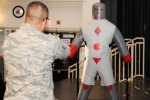 KUNSAN AIR BASE, Republic of Korea -- Master Sgt. Gabriel Gonzalez, 8th Security Forces Squadron member, demonstrates proper technique when using a taser to subdue subjects.  The taser is the newest non-lethal force asset option for security forces members to use to contain potentially harmful situations. (U.S. Air Force photo/Staff Sgt. Jonathan Pomeroy)
