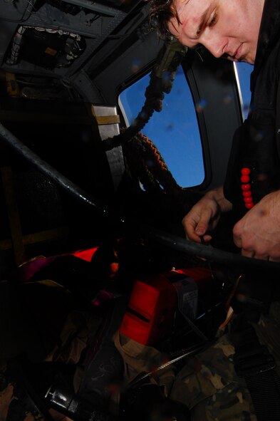 Senior Airman Nicholas Robillard, a pararescueman with the 31st Rescue Squadron  performs medical treatment on a simulated survivor during the Keen Sword exercise Dec. 6. Keen Sword is designed to allow the United States and Japan to practice and evaluate the coordination procedures and interoperability elements required to effectively and mutually respond to the defense of Japan, or to a regional crisis or contingency situation in the Asia-Pacific region, while building bilateral confidences and working relationships. ( U.S. Air Force photo/ Staff Sgt. Lakisha A.Croley)