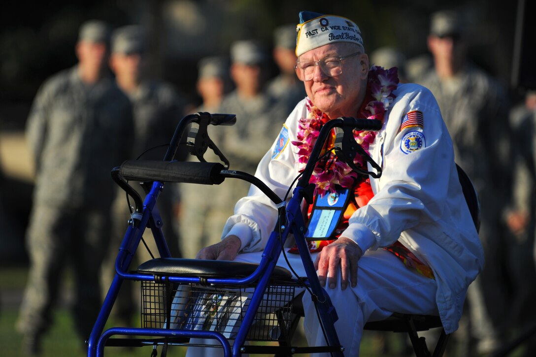 Pearl Harbor and Hickam Airfield survivor, Frank Karas sits and watches a remembrance ceremony on Atterbury Circle, Joint Base Pearl Harbor-Hickam, Hawaii, Dec. 7, 2010. On that fateful day back in 1941, Mr. Karas was asleep in the barracks on Hickam Field when the Japanese bombed the two bases, which prompted him to get out of bed and lend a hand in the fight for survival. 