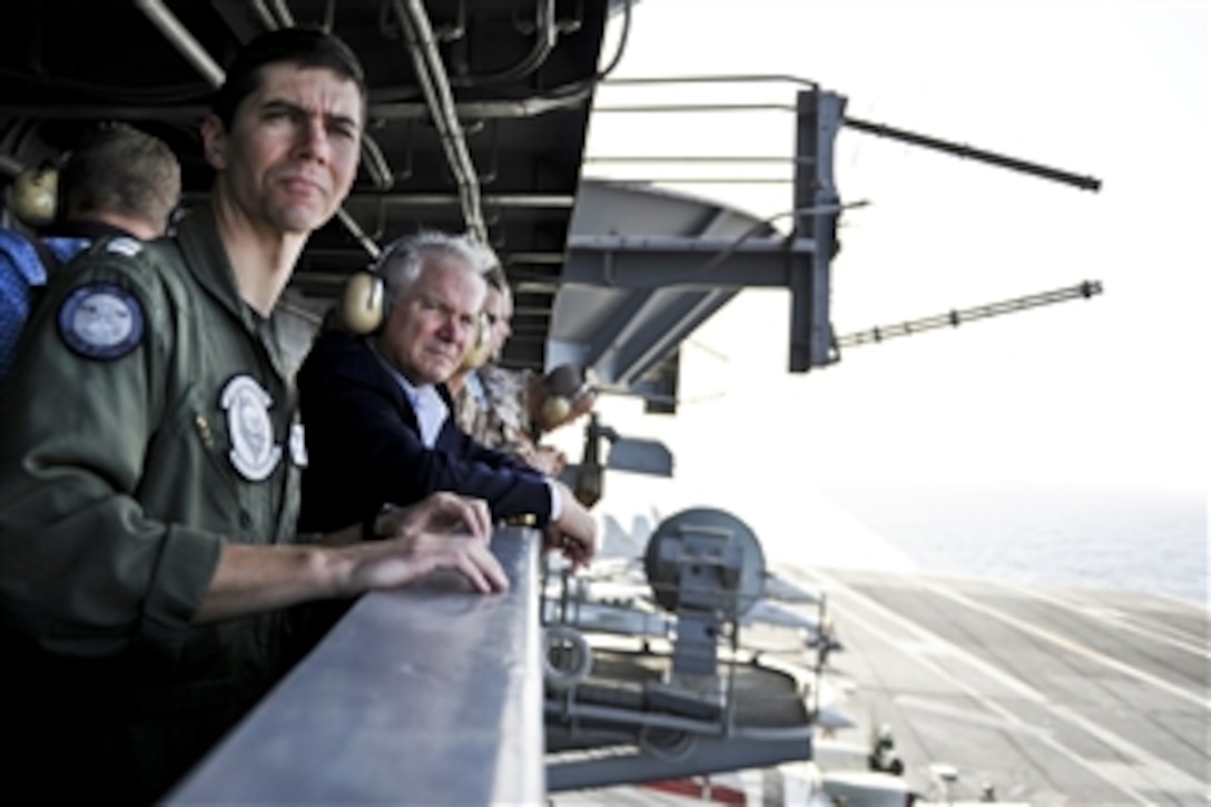 Secretary of Defense Robert M. Gates (2nd from left) observes flight operations aboard the aircraft carrier USS Abraham Lincoln (CVN 72) underway in the Arabian Sea on Dec. 6, 2010.  