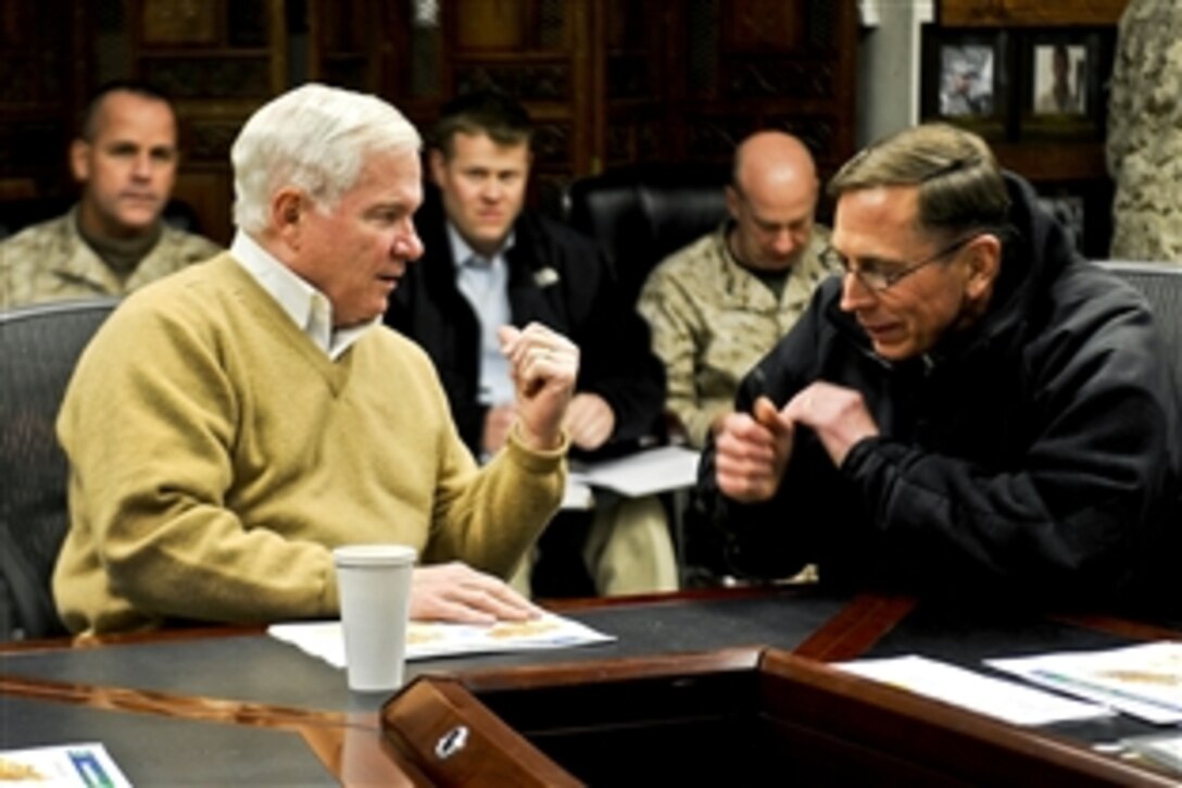 U.S. Defense Secretary Robert M. Gates talks with U.S. Army Gen. David H. Petraeus, commander of  NATO and International Security Assistance Force troops on Camp Eggers in Kabul, Afghanistan, Dec. 7, 2010. Gates is in Afghanistan to receive operational updates and thank troops for their service.