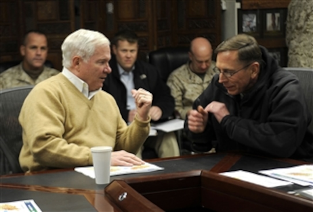 Secretary of Defense Robert M. Gates talks with Commander International Security Assistance Force Army Gen. David Petraeus at Camp Eggers in Kabul, Afghanistan, on Dec. 7, 2010.  Gates is in Afghanistan receiving operational updates and thanking the troops for their service.  