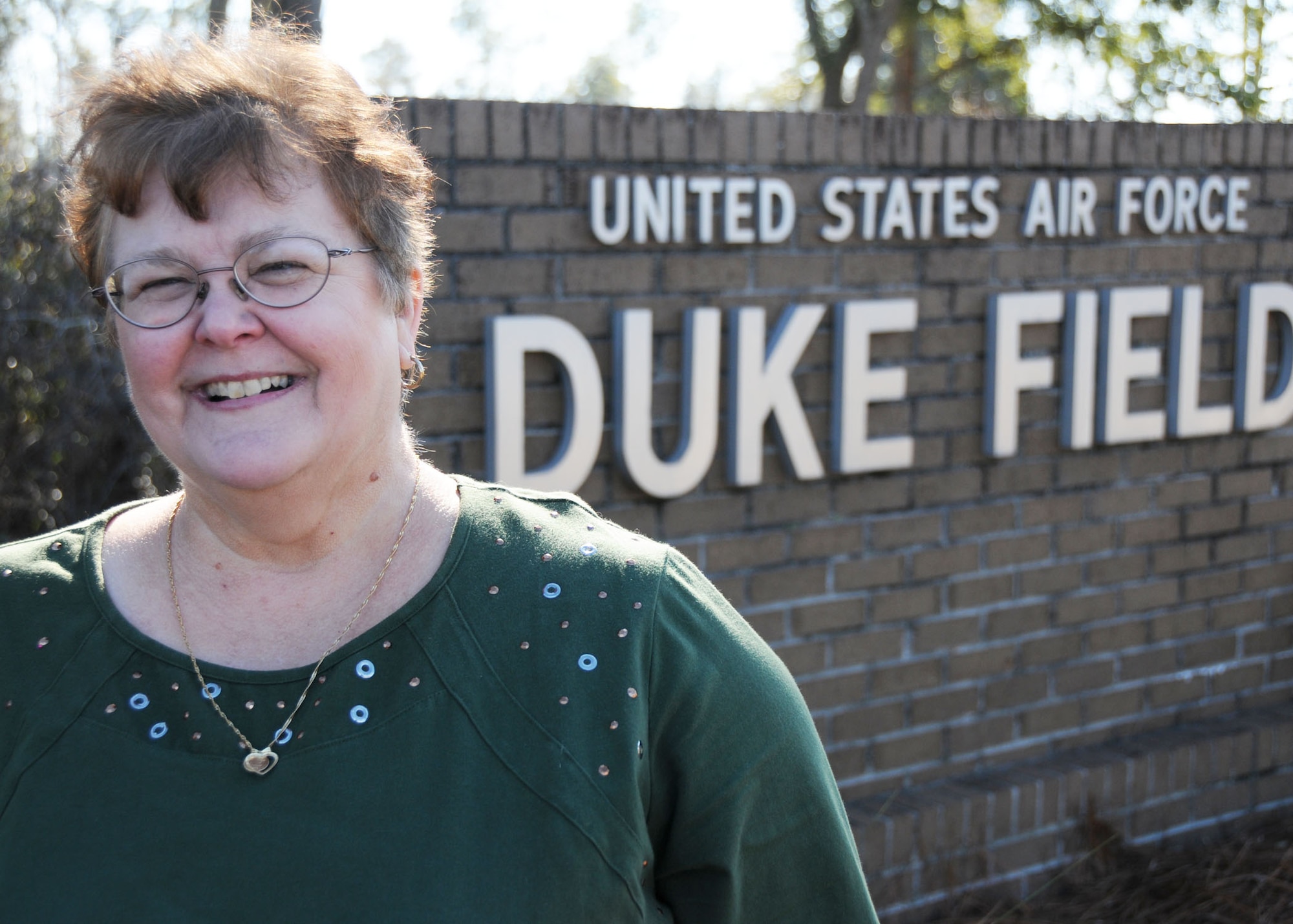 Ann Avant, the first female non-prior service enlisted Airman at Duke Field, Fla., put a career of nearly four decades of military and federal civilian service behind her as she retired Dec. 4.    The Defuniak Springs, Fla., native launched her career in 1972 when the base's 919th Special Operations Wing was in its infancy. (U.S. Air Force photo/Adam Duckworth)