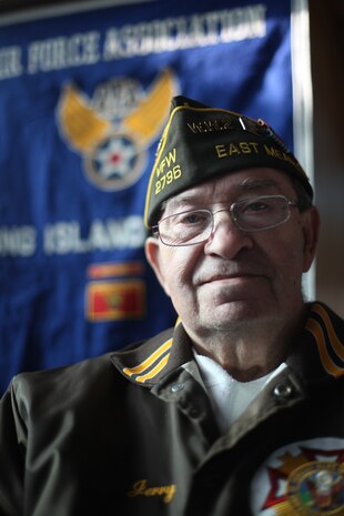 FARMINGDALE, N.Y. -- Gerard Barbosa was a 17-year-old gunner's mate sailor when his ship, USS Raleigh, was attacked at Pearl Harbor, Hawaii. Barbosa, an East Meadow resident, was among four Pearl Harbor survivors recognized on the 69th anniversary of the attack at the Dropping of the Roses / Pearl Harbor Memorial Ceremony, here, Dec. 7. This is the 20th year of a tradition started by the late Joseph Stanley Hydrusko to honor those he served with at Pearl Harbor, Hawaii. Each year roses are dropped over the Statue of Liberty marking the time of the attack. In the attack, 21 ships were sunk or damaged, 188 aircraft were destroyed, and 2,335 service members were killed. America answered with an island-hopping campaign culminating with the iconic Marine Corps flag raising on Iwo Jima more than three years later. (Official Marine Corps photo by Sgt. Randall A. Clinton / RELEASED)