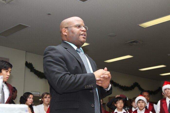 Allen Strawbridge, the Matthew C. Perry High School music director, speaks to the students from his music department before the Winter Extravaganza begins at the Marine Memorial Chapel here Dec. 8.