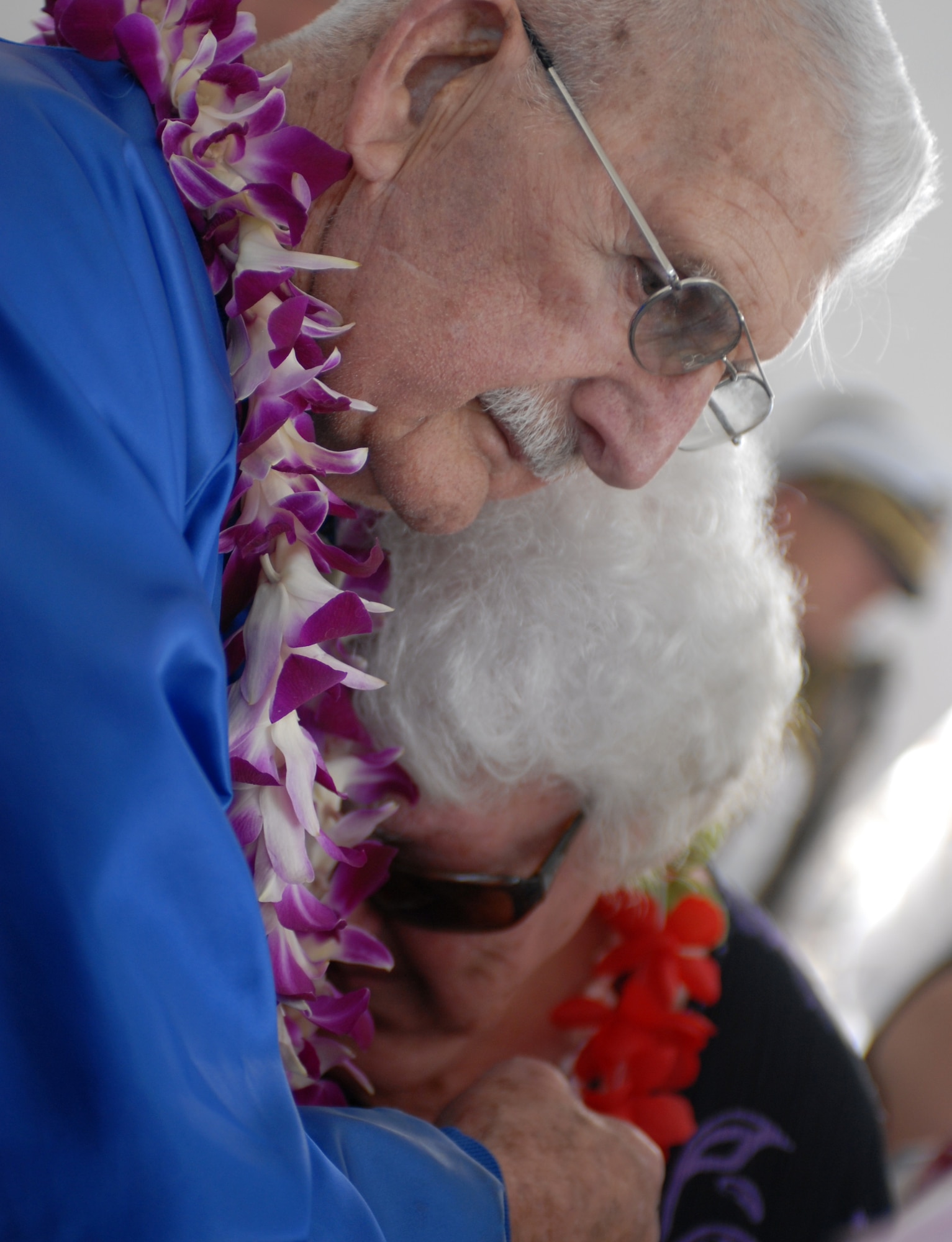 Hank Grenier, a member of the Pearl Harbor Survivors Association, comforts a crying woman on board the USS Arizona Memorial Dec. 7, 2010. (U.S. Air Force photo by Staff Sgt. Carolyn Viss)