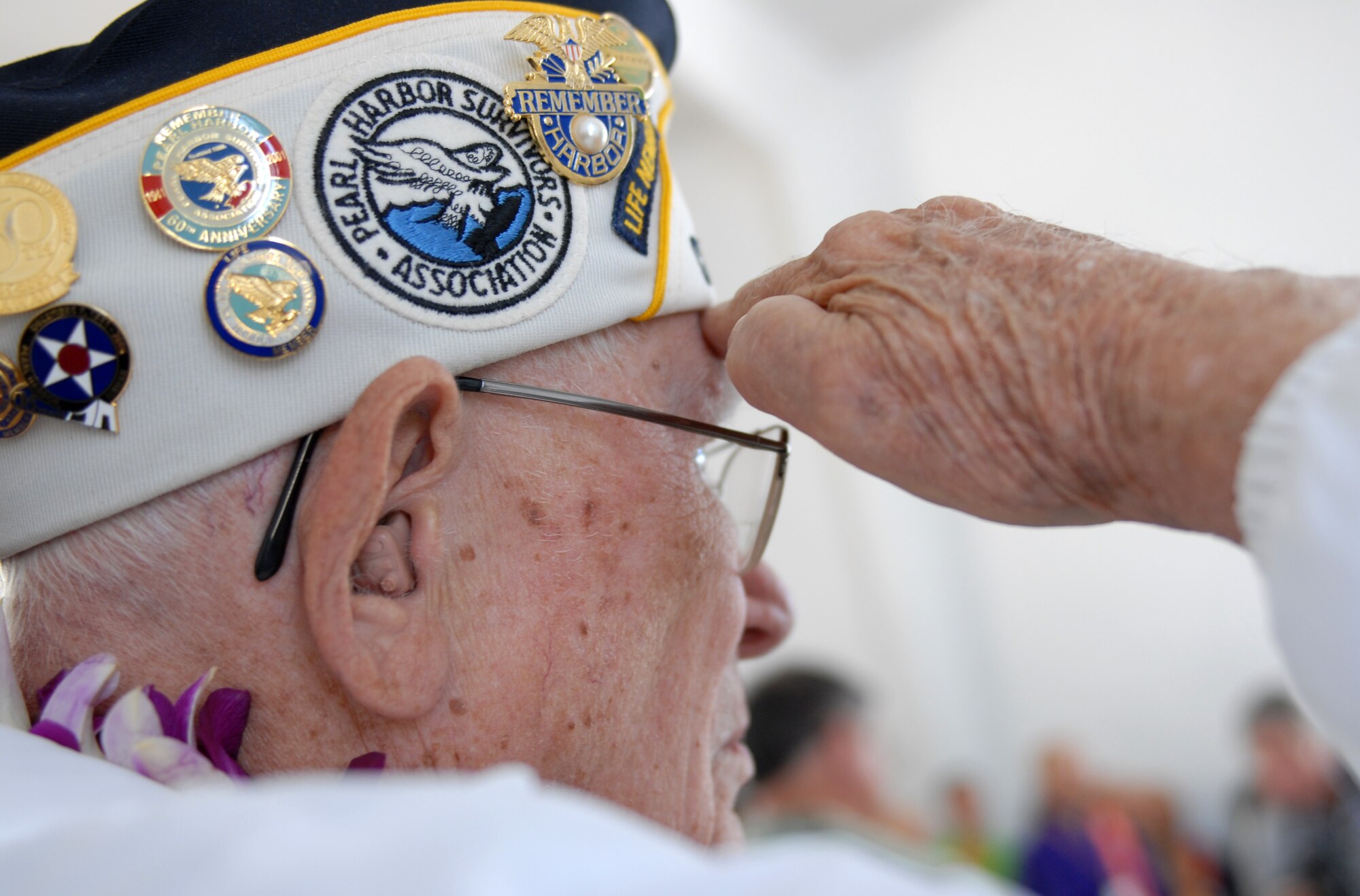 A survivor of the Japanese attacks on Pearl Harbor Dec. 7, 1941, pays his respects on board the USS Arizona Memorial Dec. 7, 2010. (U.S. Air Force photo by Staff Sgt. Carolyn Viss)