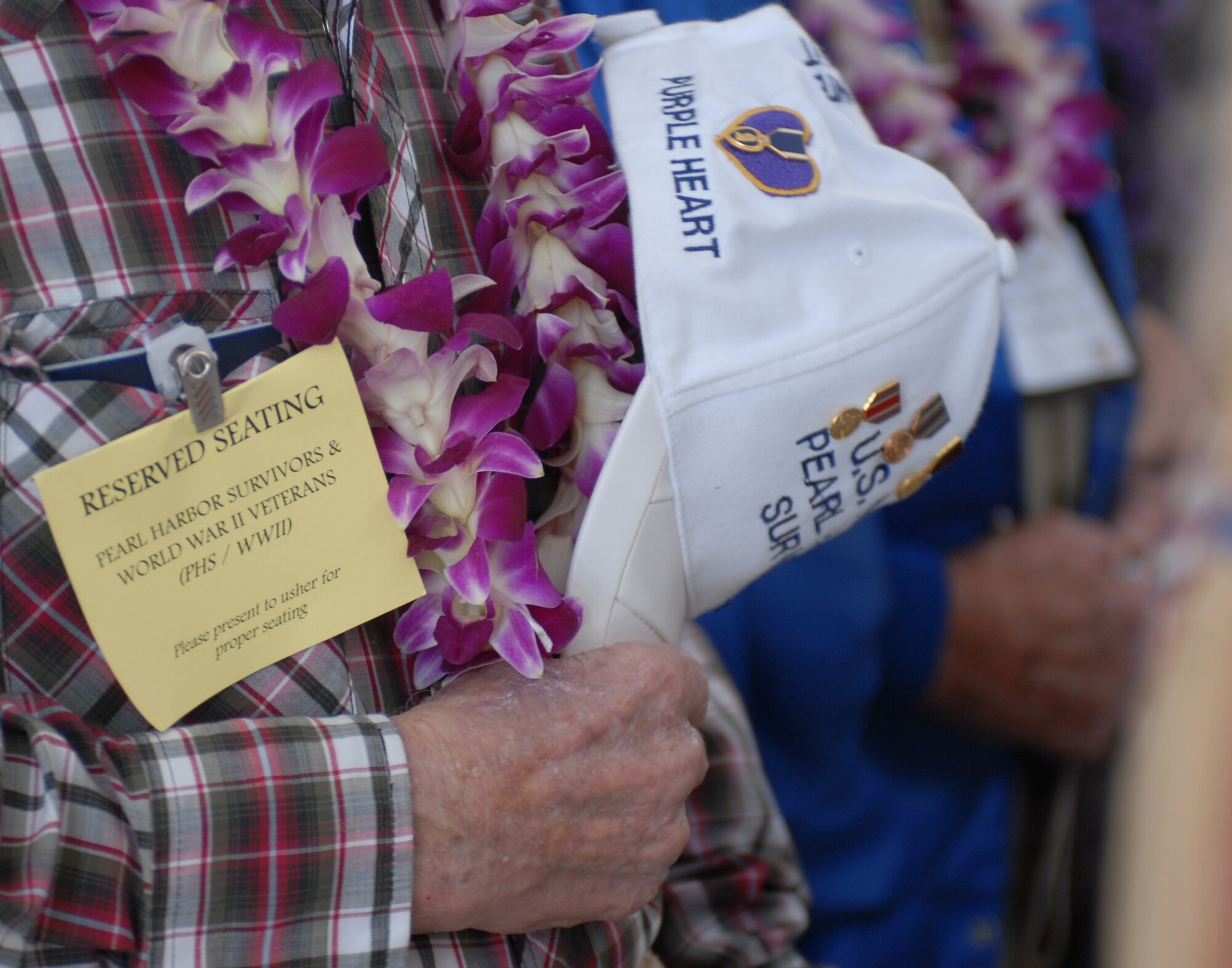 A Purple Heart recipient and survivor of the Japanese attacks on Pearl Harbor Dec. 7, 1941, pays his respects on board the USS Arizona Memorial Dec. 7, 2010. (U.S. Air Force photo by Staff Sgt. Carolyn Viss)