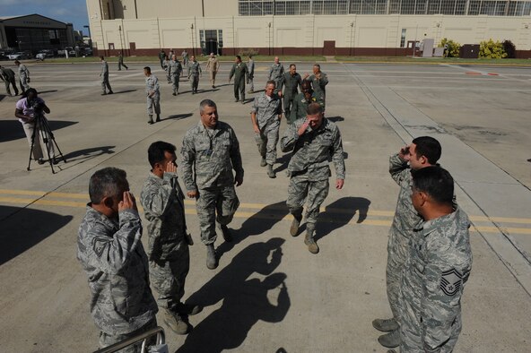 Gen. Gary North, Commander, Pacific Air Forces, returns a salute before receiving a tour of a KC-135 Stratotanker at Joint Base Pearl Harbor-Hickam, Hawaii, Dec. 3. During his visit, General North toured various locations on base including Hangar 13, the 15th Wing Headquarters and the 15th Medical Group.  (U.S. Air Force photo/Airman 1st Class Lauren Main)
