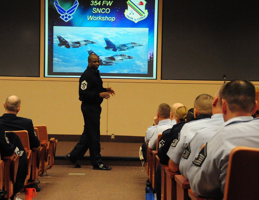 Chief Master Sgt. Jerry Moore speaks to a group of Senior NCOs Dec. 6, 2010, Eielson Air Force Base, Alaska. A SNCO Workshop provided Eielson's enlisted leaders with a strategic view of the Eielson mission and aimed to improve senior NCO communication. The workshop speakers included the 11th Air Forces Command Chief, 354th Fighter Wing Vice commander, and the 354th FW Command Chief. Chief Moore is the 354th FW command chief. (U.S. Air Force photo/Senior Airman Rachelle Coleman)
