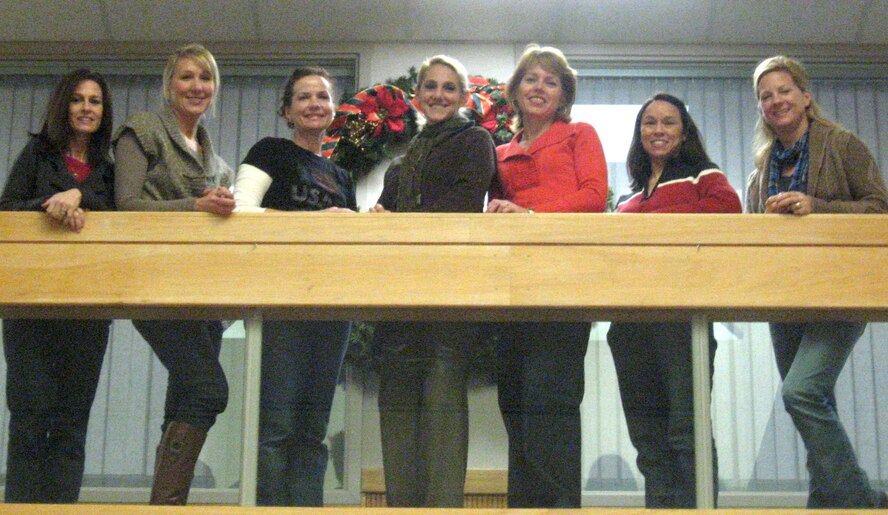 The Christmas Elves who will be working at Breakfast with Santa, 10 a.m. to noon, Saturday, Dec. 11, in Hangar 170, are, from left, Photography Elf Donna Balutski, Craft Elf Deb Meidel, Helper Elf Cyndi Witek, Head Elf Kate Holdeman, Mrs. Santa Claus (Lynne Mack), Photography Elf Cathy Curry and Games Elf Nancy Gibson. All the Christmas Elves, except Ms. Holdeman, are the wives of senior leaders at Vance. Ms. Holdeman is the Vance Youth Programs coordinator. (U.S. Air Force photo)