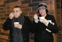 GARRISON, N.D. -- Airmen Jacob Balanzategui and Margherita Romano, both 5th Maintenance Operations Squadron maintenance management analysts from Minot Air Force Base, N.D., visited the Dickens Village Festival here Dec. 4 to indulge in the many activities of the area. As part of their visit, the two purchased soup from local vendors. (BHG News Service photo/Cheryl Odden)