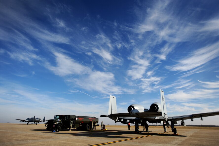 The 442nd Fighter Wing Air Reserve technicians, and the 509th Logistics Readiness Squadron Fuels Operators work together conducting hot pit refuels for A-10 Thunderbolt II pilots, Dec. 8. Hot pit refueling is a procedure usually performed in a combat situation to rapidly refuel aircraft while their engines are running resulting in a speedy refuel to thrust pilots right back into the fight. 442nd Air Reserve technicians practice this procedure to keep their skills sharp. (U.S. Air Force photo by Senior Airman Kenny Holston)(Released)