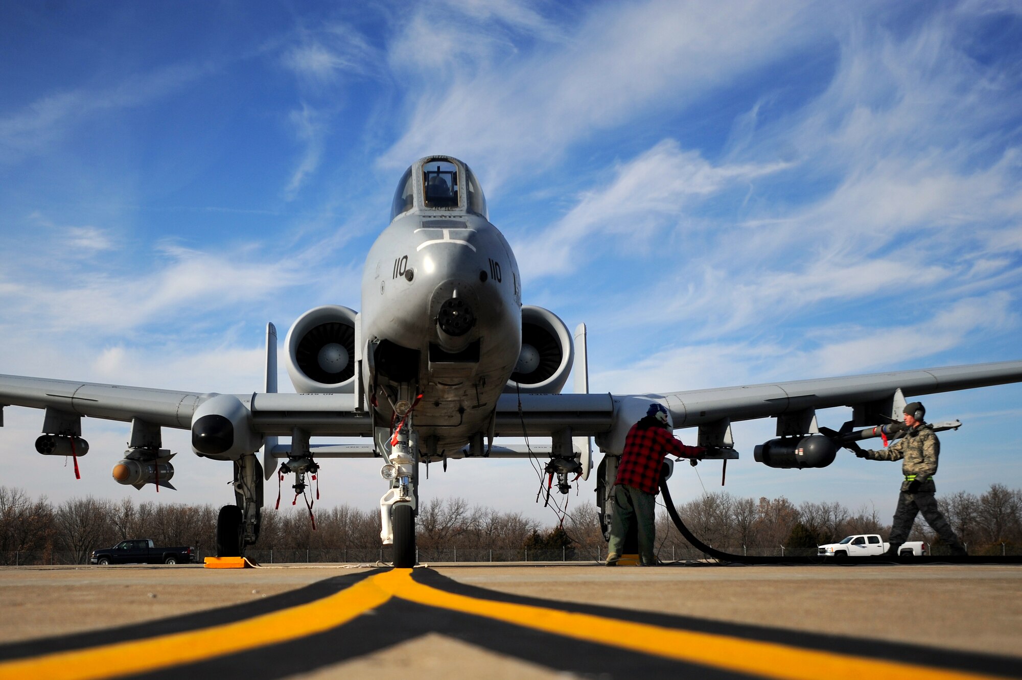 Tech. Sgt. Dewayne Magnuson, 442nd Fighter Wing Air Reserve technician, and Senior Airman James White, 509th Logistics Readiness Squadron fuels operator, work together to perform a hot pit refuel on a 442nd Fighter Wing A-10 Thunderbolt II, Dec. 8. Hot pit refueling is a procedure usually performed in a combat situation to rapidly refuel aircraft while their engines are running resulting in a speedy refuel to thrust pilots right back into the fight. The 442nd Air Reserve technicians practice this procedure to keep their skills sharp. (U.S. Air Force photo by Senior Airman Kenny Holston)(Released)