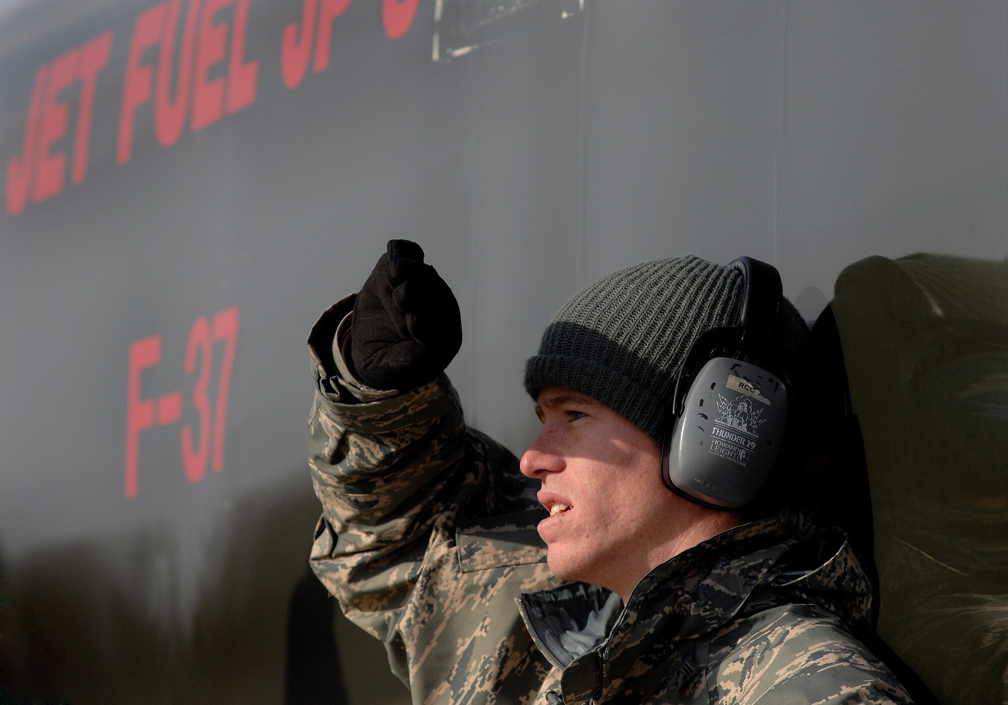 Senior Airman James White, 509th Logistics Readiness Squadron fuels operator, observes a hot pit refuel for a 442nd A-10 Thunderbolt II, Dec. 8. Hot pit refueling is a procedure usually performed in a combat situation to rapidly refuel aircraft while their engines are running resulting in a speedy refuel to thrust pilots right back into the fight. The 442nd Air Reserve technicians practice this procedure to keep their skills sharp. (U.S. Air Force photo by Senior Airman Kenny Holston)(Released)
