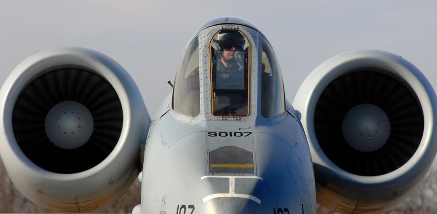 A 442nd Fighter Wing A-10 Thunderbolt II pilot sits on the ramp in the cockpit of his A-10 while crew chiefs perform a hot pit refuel for his aircraft, Dec. 8. Hot pit refueling is a procedure usually performed in a combat situation to rapidly refuel aircraft while their engines are running resulting in a speedy refuel to thrust pilots right back into the fight. The 442nd Air Reserve technicians practice this procedure to keep their skills sharp. (U.S. Air Force photo by Senior Airman Kenny Holston)(Released)
