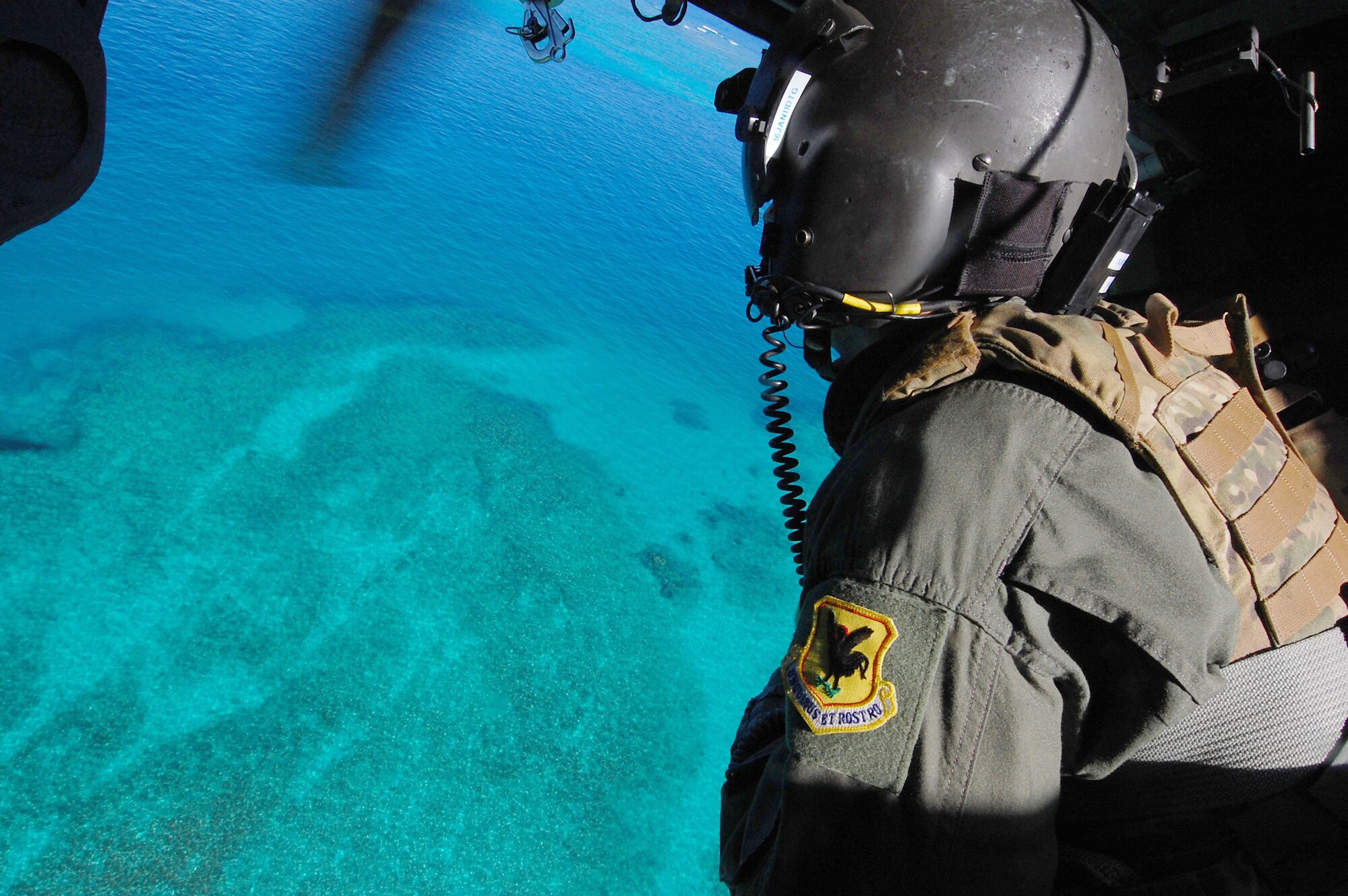 Senior Airman Jeremy observes the rescue area during the Keen Sword exercise Dec. 6, 2010, Kadena Air Base, Japan.  Keen Sword 2011 involves joint U.S. forces and Japan forces from all components of both militaries training to conduct bilateral operations in support of the defense of Japan. Airman Garrett is a flight engineer with the 33rd Rescue Squadron. (U.S. Air Force photo/Staff Sgt. Lakisha A. Croley)
