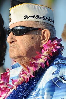 Phil Corsello, a Hickam Field survivor of the Dec. 7, 1941 attacks, stands during the playing of the national anthem at the start of the 69th anniversary ceremony of the surprise attacks on the Hawaiian Islands. Airmen, families and veterans gathered at Atterbury Circle, the site of same flag pole that stood Dec. 7, 1941, to commemorate the lives and the sacrifices of the men and women who were there on that day. (U.S. Air Force/Staff Sgt. Mike Meares)