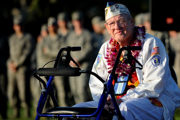 Frank Karas, a Hickam Field survivor of the Dec. 7, 1941 attacks, takes in the scene before the start of the 69th anniversary ceremony of the surprise attacks on the Hawaiian Islands. Airmen, families and veterans gathered at Atterbury Circle, the site of same flag pole that stood Dec. 7, 1941, to commemorate the lives and the sacrifices of the men and women who were there on that day. (U.S. Air Force/Staff Sgt. Mike Meares)