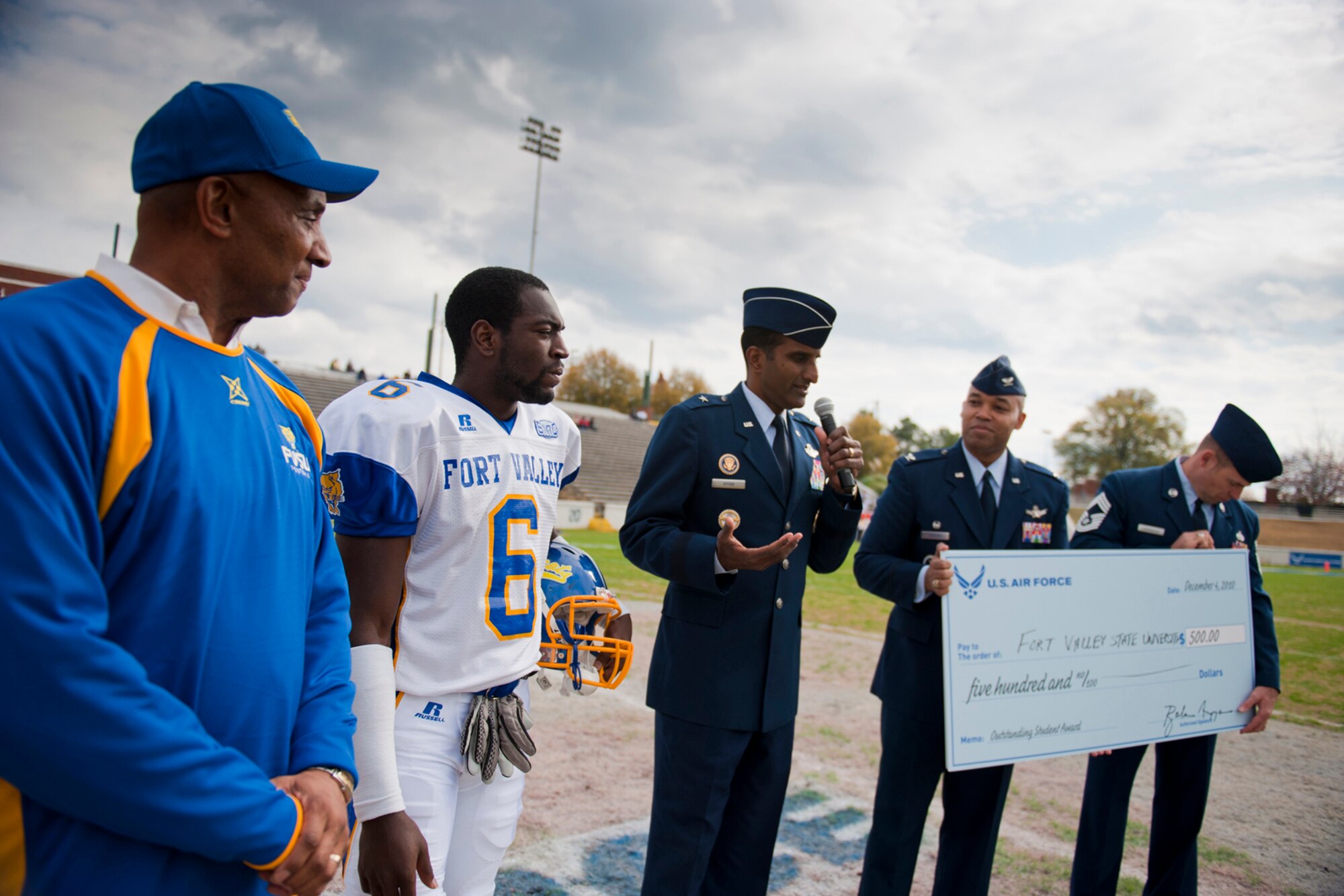 Brig. Gen. Balan R. Ayyar, the Air Force Recruiting Service commander, makes a few remarks before presenting a $500 scholarship check to representatives of Fort Valley State University Dec. 4, 2010, during the 2010 Pioneer Bowl at the A.J. McClung Memorial Stadium in Columbus, Ga. The check was accepted on behalf of the school by Tony Reid, an FVSU running back. (U.S. Air Force photo/Senior Airman Jamal D. Sutter)