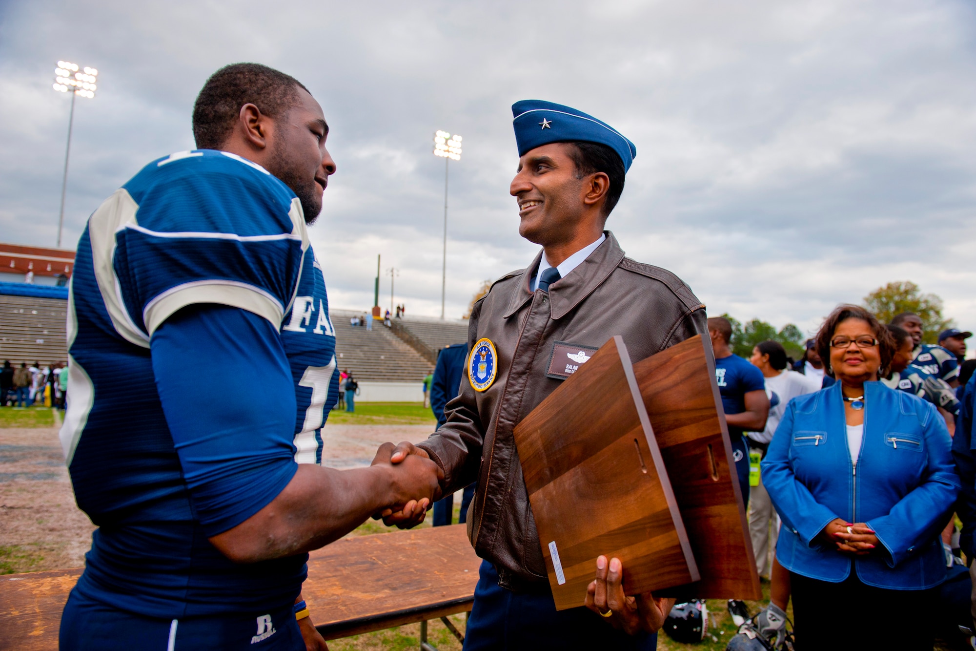 Brig. Gen. Balan R. Ayyar, the Air Force Recruiting Service commander, congratulates Jone' Harris, a tight end for the St. Augustine's College Falcons, for earning the 2010 Pioneer Bowl Most Valuable Player and Offensive MVP awards during his team's 20-9 victory over the Fort Valley State University Wildcats Dec. 4, 2010, at the A.J. McClung Memorial Stadium in Columbus, Ga.. Harris caught three passes for 54 yards and scored two touchdowns. He is a senior majoring in mathematics. (U.S. Air Force photo/Senior Airman Jamal D. Sutter)
