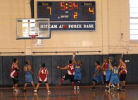 Athletes in the Special Olympics play basketball at the Hickam gym at Joint Base Pearl Harbor-Hickam, Hawaii, Dec. 4, 2010. (U.S. Air Force photo/Staff Sgt. Carolyn Viss)