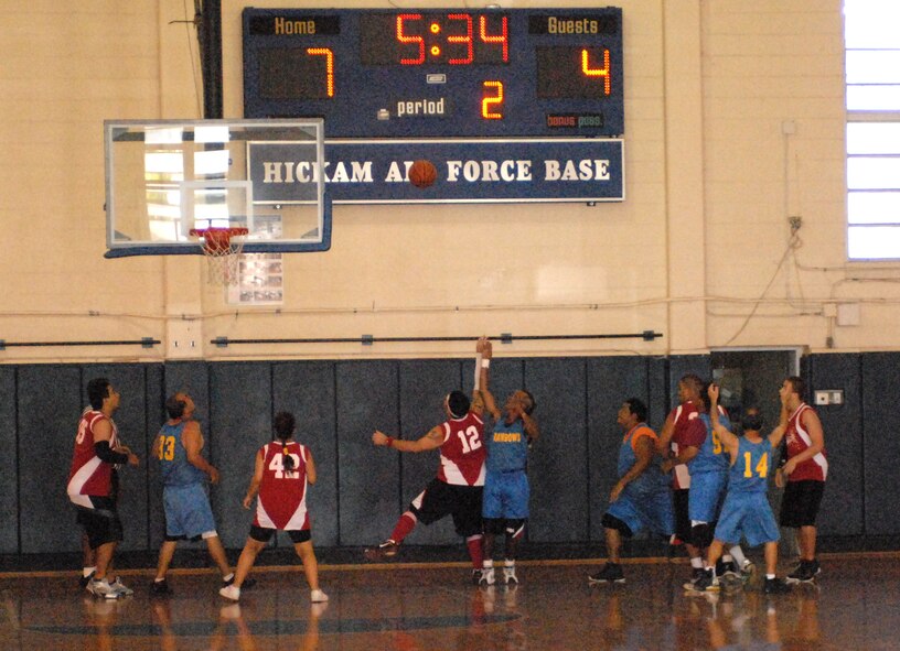 Athletes in the Special Olympics play basketball at the Hickam gym at Joint Base Pearl Harbor-Hickam, Hawaii, Dec. 4, 2010. (U.S. Air Force photo/Staff Sgt. Carolyn Viss)