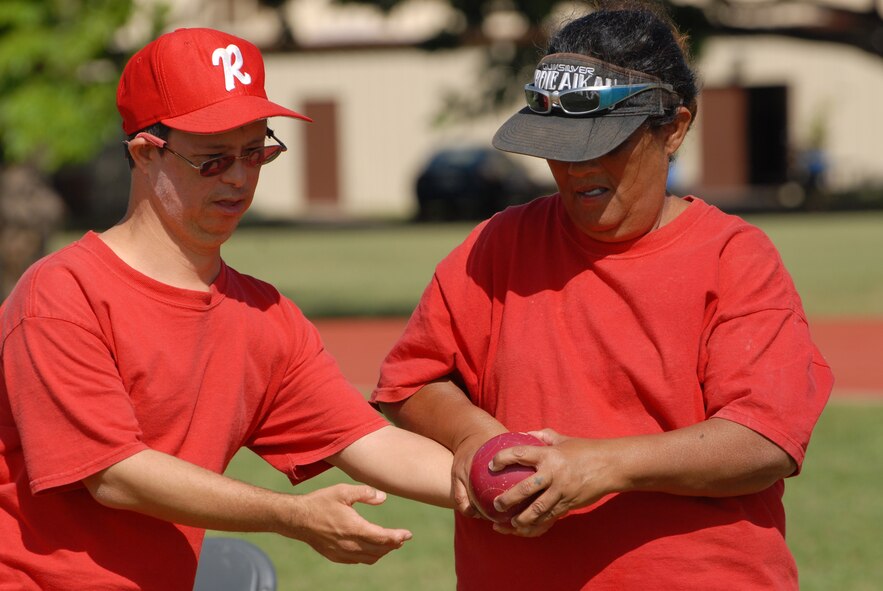 The "Rainbow Bocce Babes" share a moment of camaraderie during a game at Joint Base Pearl Harbor-Hickam, Hawaii, Dec. 4, 2010. (U.S. Air Force photo/Staff Sgt. Carolyn Viss)