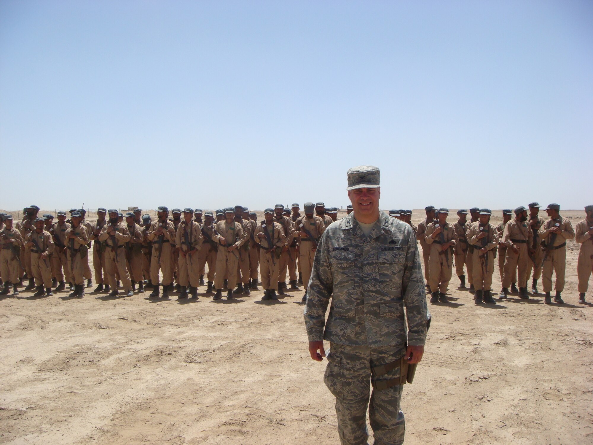 Vice Chief of Staff for the Minnesota National Guard, Col. Paul Cummings in formation with Afghan police recruits outside of Camp Leatherneck in the Helmand Province of Southwestern Afghanistan in April 2010.  (Submitted- National Guard Photo)