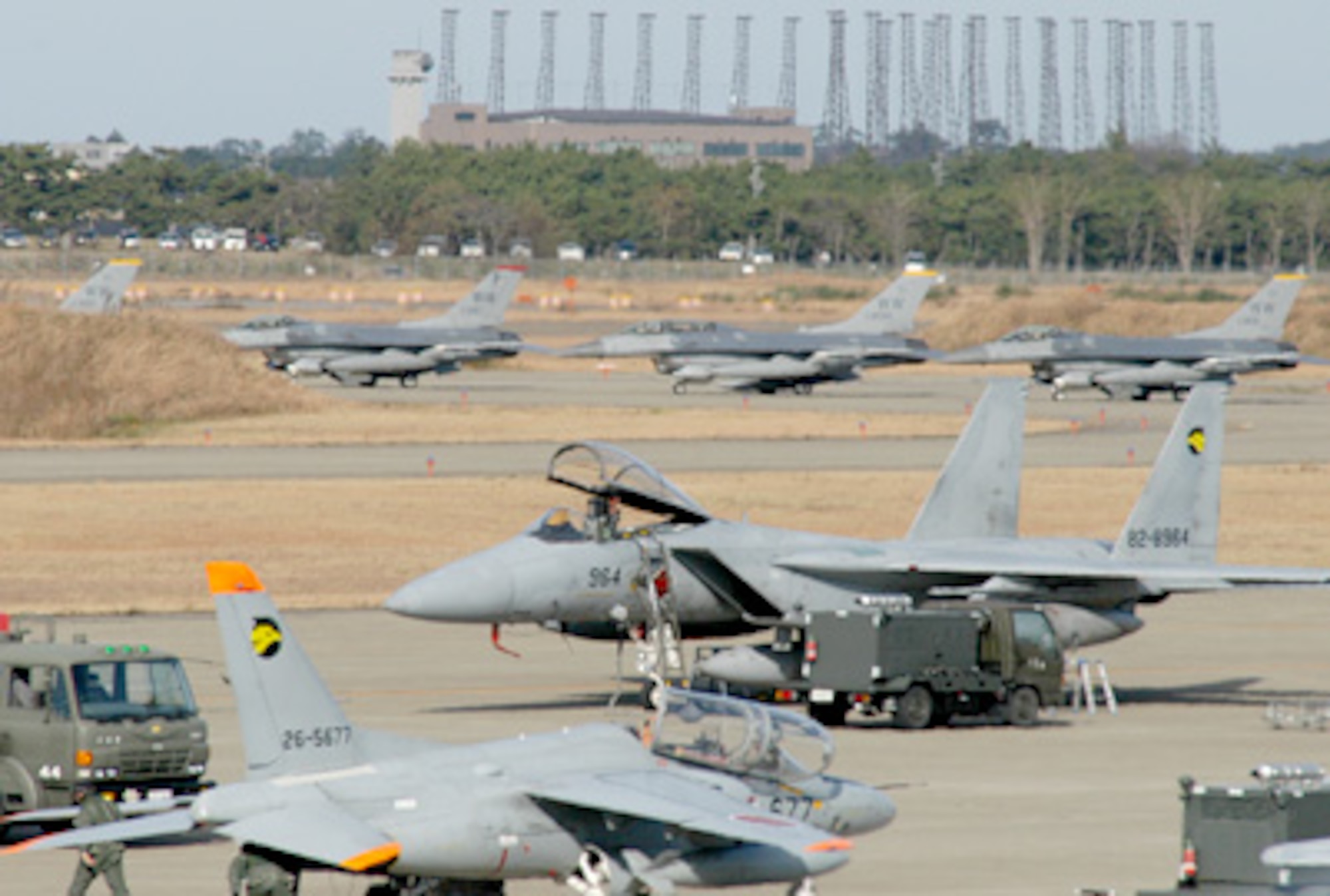 Japanese Air Self-Defense Force and U.S. Air Force Airmen ready aircraft Dec. 7, 2010, at Komatsu ASDF Base during exercise Keen Sword 2011. Chairman of the Joint Chiefs of Staff Admiral Mullen is calling for China to help curb North Korean agression and hopes to see "more trilateral and multilateral interaction in the region" and that he was encouraged to see South Korean observers participate in the Keen Sword exercises near Japan this week. (Courtesy Photo)
