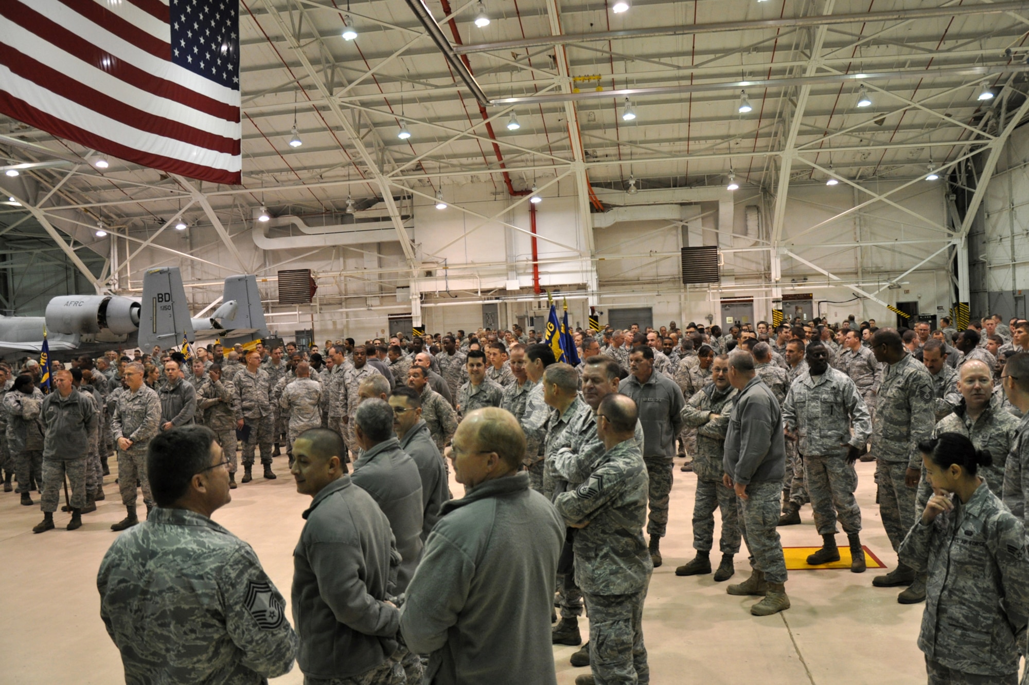 Hundreds from the 917th Maintenance Group gather for the maintenance group commander’s call in the A-10 Hangar at Barksdale Air Force Base, La., Dec. 5, 2010. A mass reenlistment and awards ceremony was conducted during the event.  (U.S. Air Force photo /Tech. Sgt. Jeff Walston)
 
