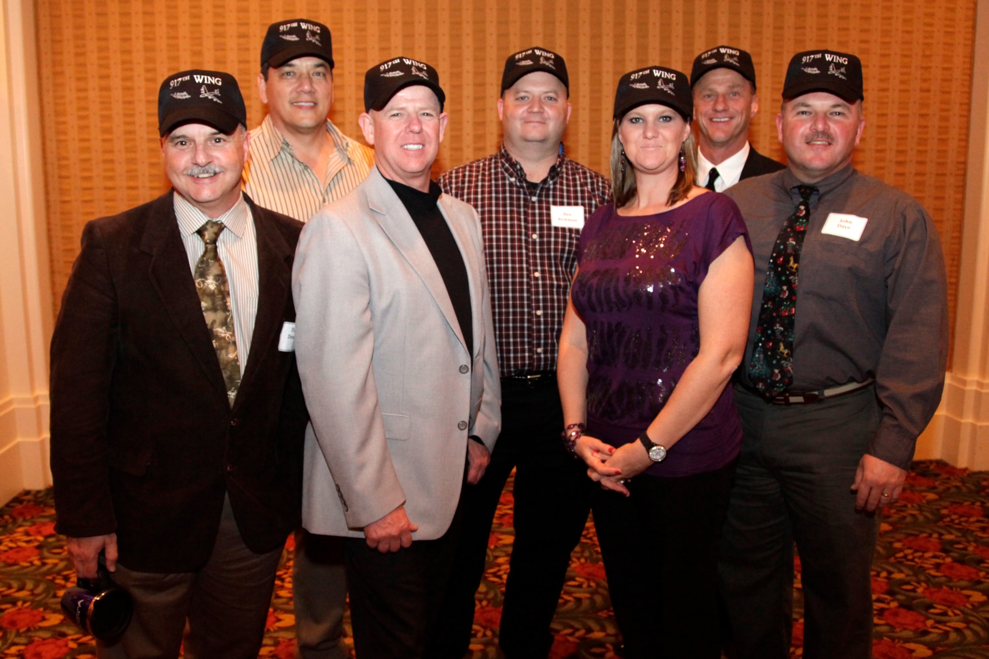Members of the 917th Wing Safety Office at Barksdale Air Force Base, La., sport wing baseball caps in a group photo at the Wing Christmas Party at the El Dorado Hotel in Shreveport, La., Dec. 4, 2010. The bi-annual event was attended by approximately 150 people. (U.S. Air Force photo /Staff Sgt. Travis Robertson)