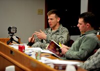 MINOT AIR FORCE BASE, N.D. -- Lt. Col. Marshall Wilde, Training by Reservist in Advocacy and Litigation Skills team instructor, gives feedback to his student during a mock trial here Dec. 3. The Minot AFB Office of the Staff Judge Advocates hosted Air Force Global Strike Command’s first joint legal training with the TRIALS team here Dec. 2 and 3. The training involved judge advocates from bases across the command as well as Ellsworth AFB, S.D., and Grand Forks AFB, N.D. (U.S. Air Force photo/Senior Airman Michael J. Veloz)