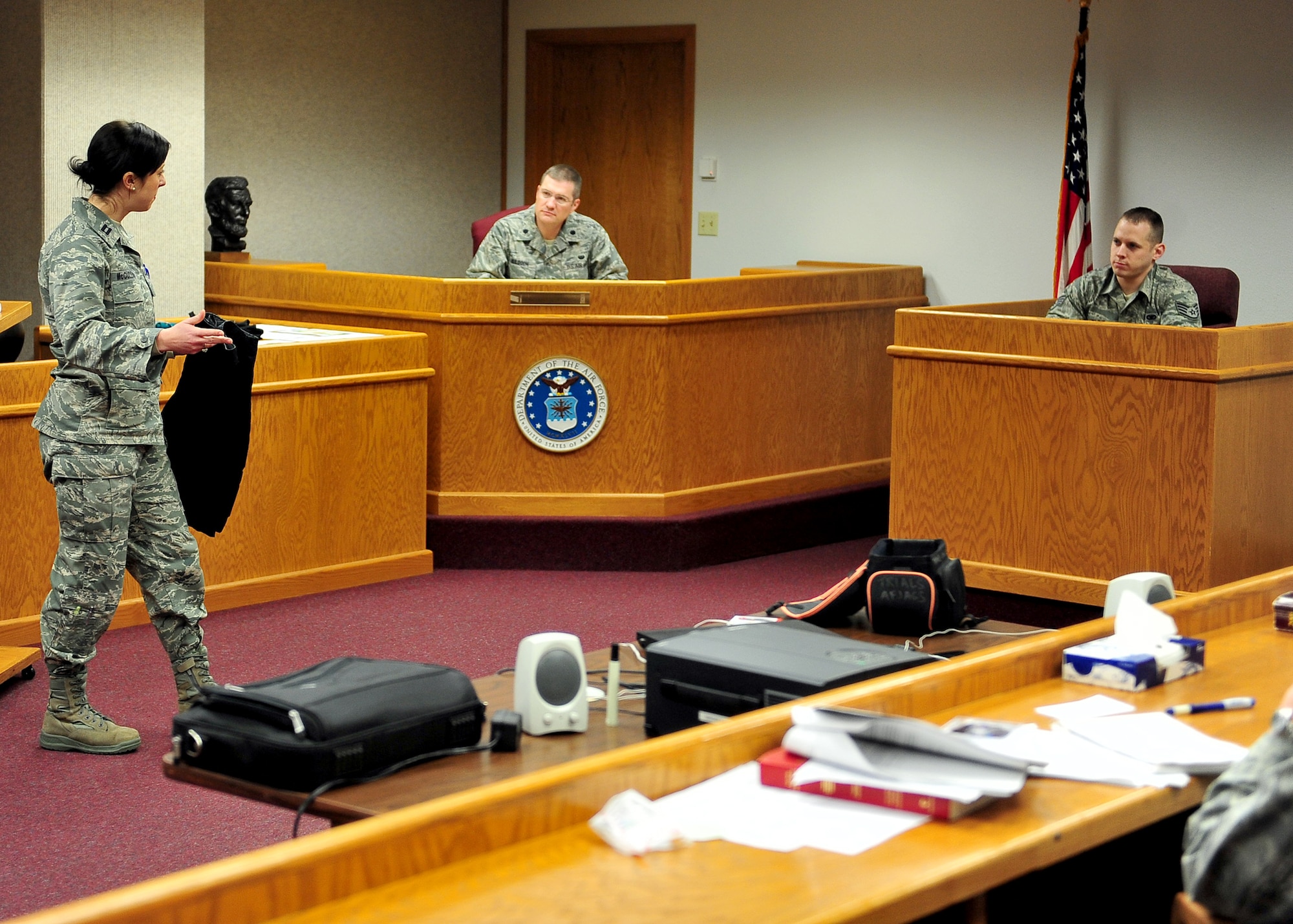 MINOT AIR FORCE BASE, N.D. -- Capt. Catherine McCulloch, 341st Missile Wing judge advocate from Malmstrom AFB, Mont., questions a witness about evidence during a mock trial here Dec. 3. The Minot AFB Office of the Staff Judge Advocates hosted Air Force Global Strike Command’s first joint legal training with the Training by Reservist in Advocacy and Litigation Skills team here Dec. 2 and 3. The training involved judge advocates from bases across the command as well as Ellsworth AFB, S.D., and Grand Forks AFB, N.D. (U.S. Air Force photo/Senior Airman Michael J. Veloz)
