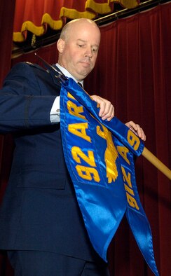 Col. Paul H. Guemmer, 92nd Air Refueling Wing commander, unveils the 912th Air Refueling Squadron guide on during a reactivation ceremony for the squadron Dec. 3, 2010 at March Air Reserve Base, Calif. The 92nd Air Refueling Wing from Fairchild Air Force Base, Wash., will have administrative control of the squadron. (U.S. Air Force Photo/Senior Airman Natasha E. Stannard) 