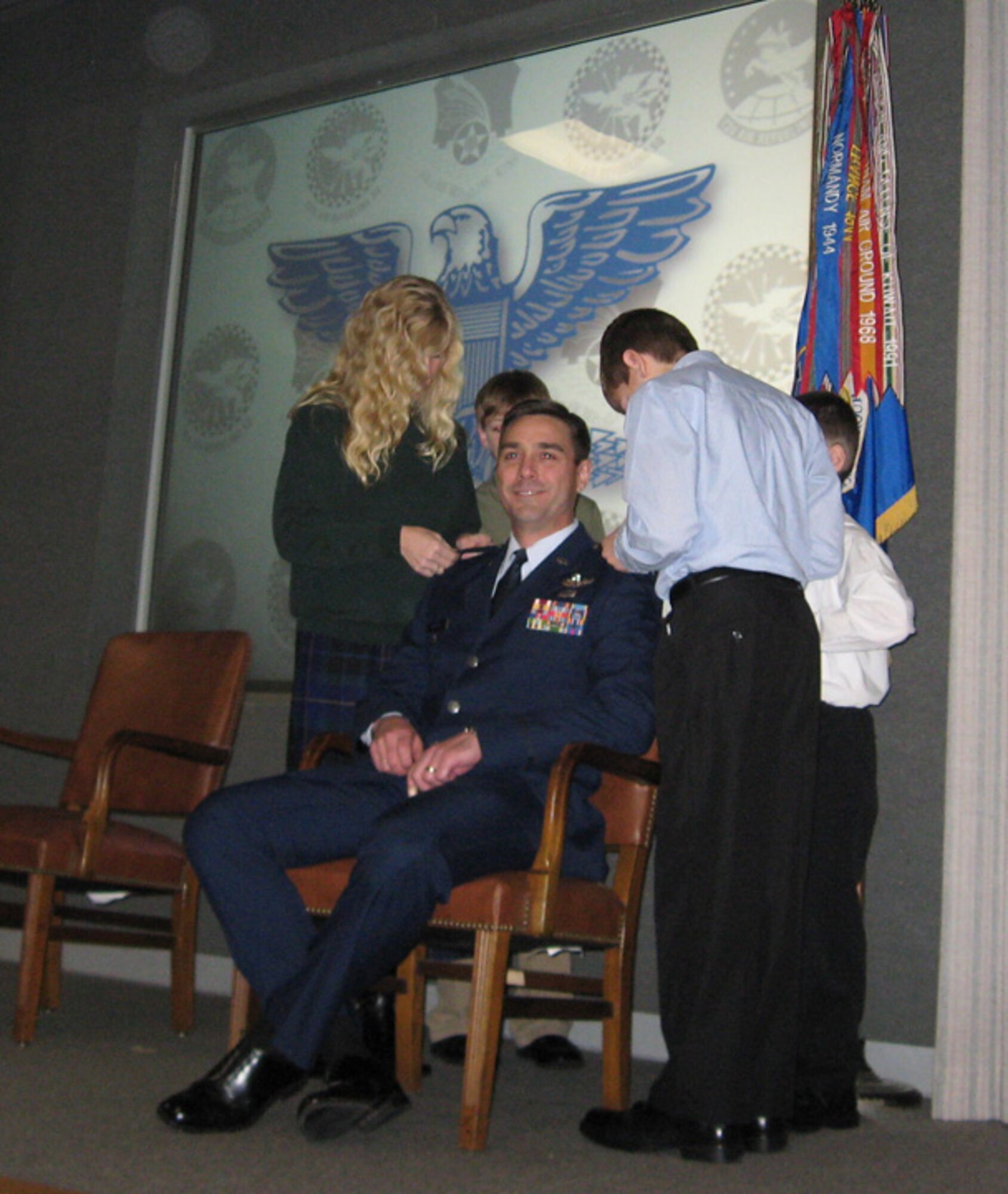 GRISSOM AIR RESERVE BASE, Ind., -- Laen August, 434th Operations Group Deputy Commander, was promoted to  the rank of colonel.  Pinning on Colonel August's new rank are family members Lisa, Alex, William and Christian. (U.S. Air Force photo)