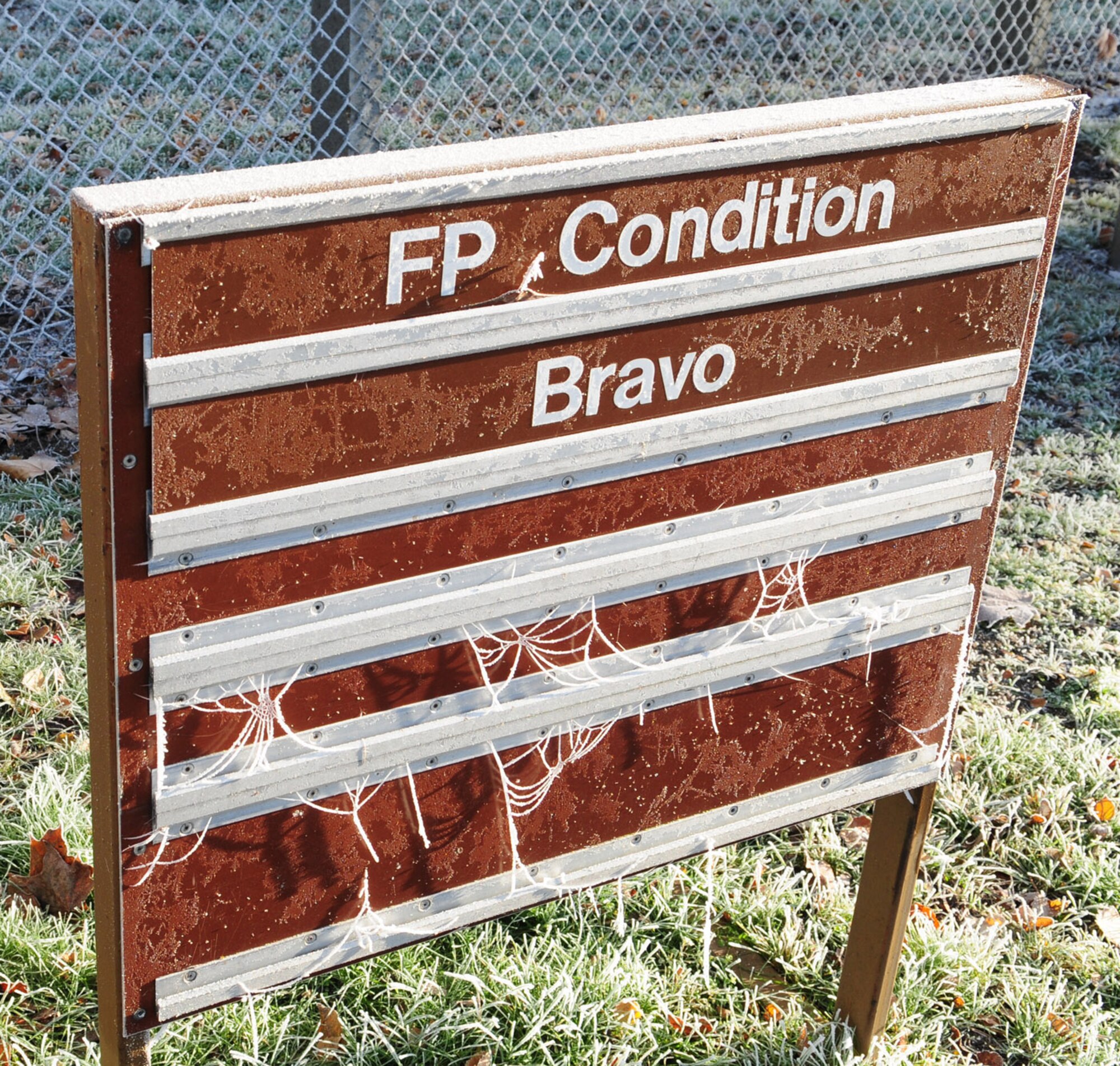 RAF MILDENHALL, England -- Frost and spider webs cover signs all over base here Dec. 7 2010. Sharp frost highlights and beautifies even the simplest and most delicate things. (U.S. Air Force photo/Karen Abeyasekere)