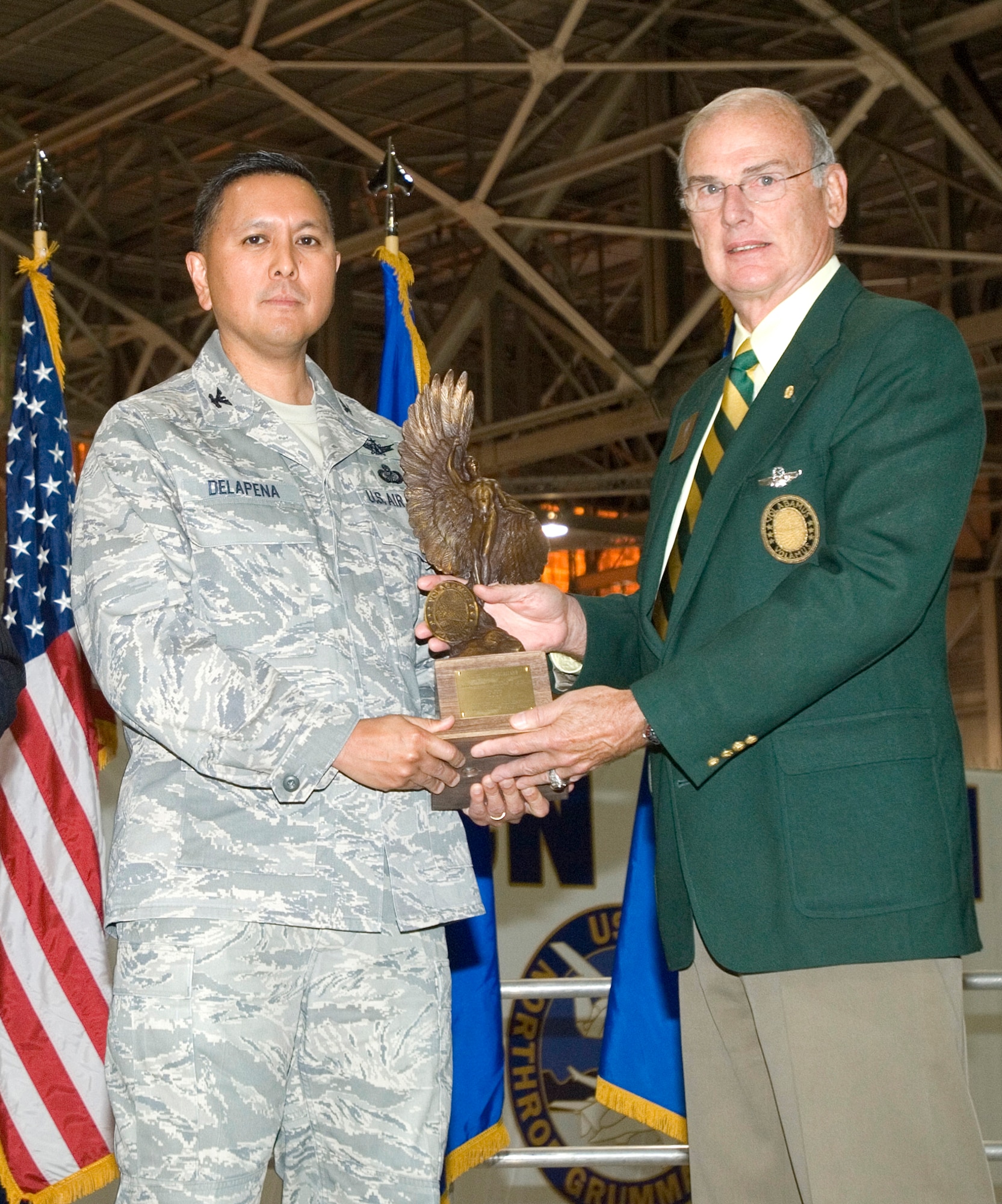 Col. Cordell DeLaPena, director of the Airborne Network Division at the Air Force Electronic Systems Center, accepts the Weapons System Award from retired Air Force Maj. Gen. D. Bruce Smith of the Order of Daedalians.  The Daedalians presented the award for work on the Battlefield Airborne Communications Node program. (Courtesy Photo)