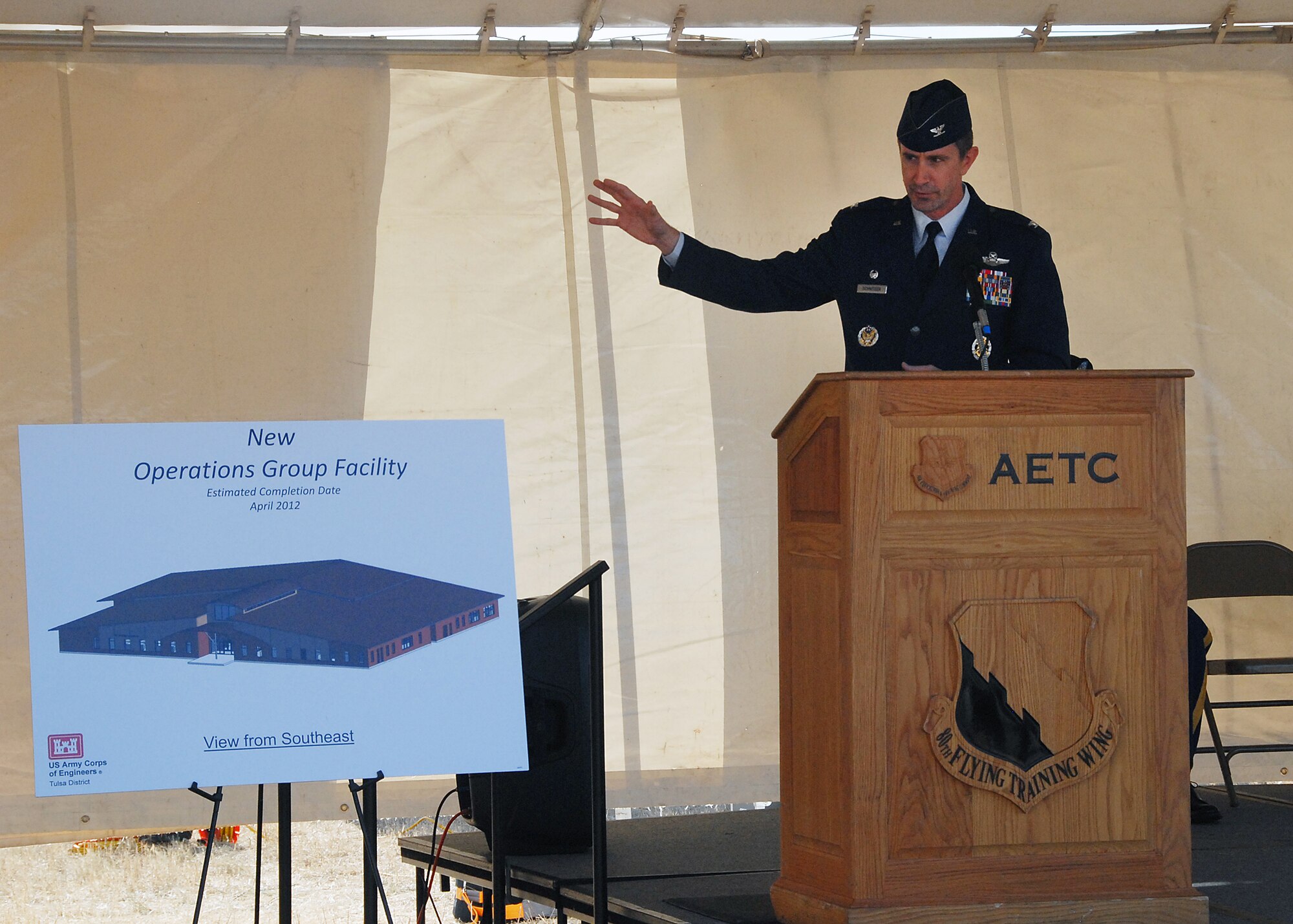 Col. Kevin Schneider, 80th Flying Training Wing commander, talks about the wing's newest construction venture Dec. 3 during a ground breaking ceremony. It will take about a year-and-a-half to construct the 55,000-square-foot operations complex at the 80th FTW, home of the Euro-NATO Joint Jet Pilot Training Program. (U.S. Air Force photo/Mike Litteken)