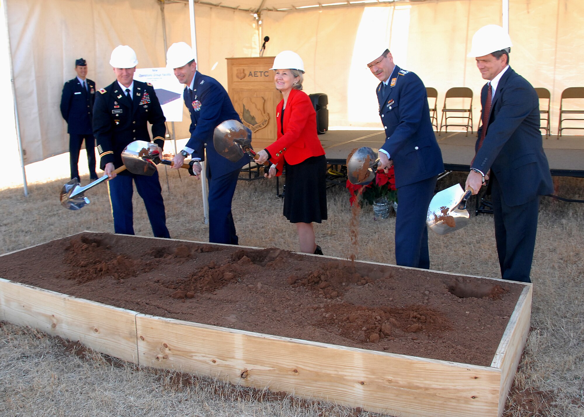 Sen. Kay Bailey Hutchison, R-Texas, (center) and 80th Flying Training Wing Commander Col. Kevin Schneider (to the senator's right) turn spades of dirt Dec. 3 during a ground breaking ceremony, marking the beginning of construction of a $15.5 million operations complex. Also pictured: Army Corps of Engineers Commander Col. Mike Teague (left); Col. Eberhard Wintzingerode-Knorr, 80th Operations Group commander (left of Senator Hutchison); and Christopher Yancey with MCC/Catamount, the contracted company that will construct the facility. The project should be complete in April 2012. (U.S. Air Force photo/Mike Litteken)