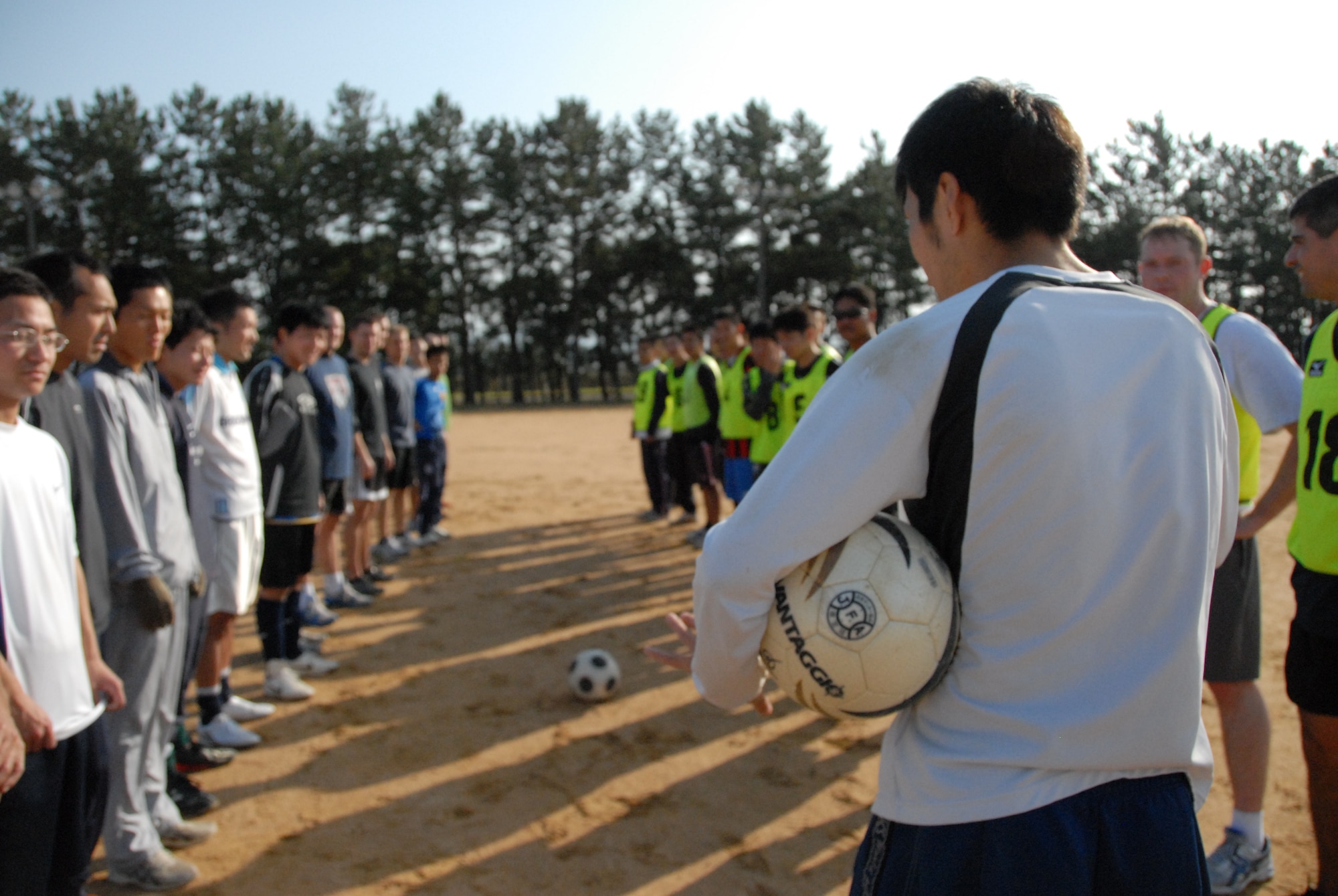 U.S. Air Force and Japan Self-Defense Force service members prepare for a joint bilateral soccer scrimmage at Komatsu JASDF base, Dec. 5, 2010. The teams took a break from operations at Keen Sword, a regularly scheduled exercise that strengthens Japan-U.S. military interoperability. (U.S. Air Force photo by 1st Lt. Cammie Quinn/ Released)